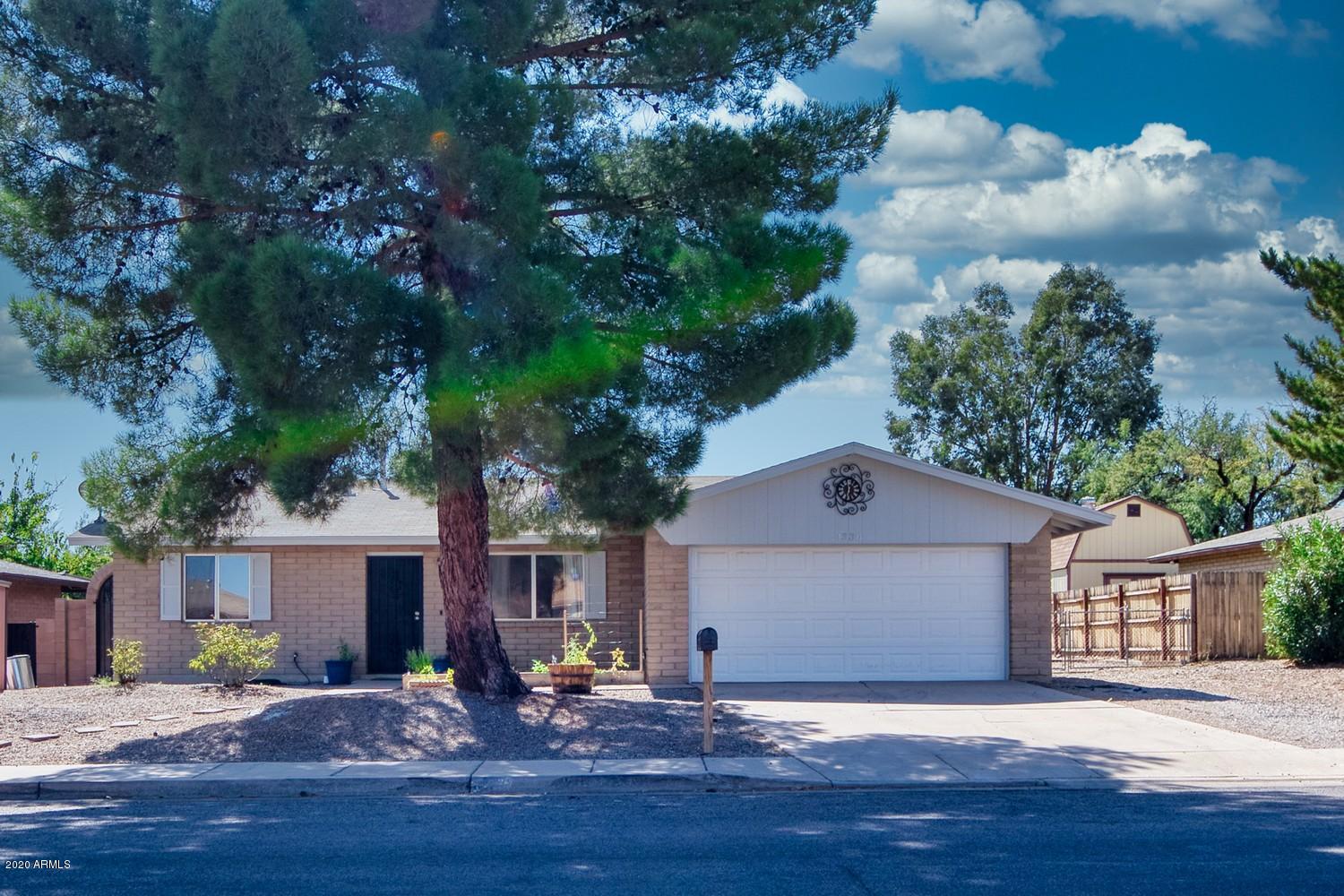 DON'T MISS THIS MOVE IN READY HOME!!!! This gorgeous 3 bedroom 2 bath home is ready for new owners. Inside of the home has been repainted. High traffic areas have wood look a like tile. Kitchen has been completely remodeled with corian countertops.  42'' upper custom cabinets and tons of lower cabinets which gives you plenty of countertop space. Hall bath has been remodel with new tile surround in the tub/shower. Lager two car garage with extra storage. Large 50 gallon water heater. Newer furnace and newer evaporative cooler. On the side of the home you will find space to park a motor home or travel trailer. You will even have a separate 30 amp plug in. This home will not last long so call me today for a private showing.
