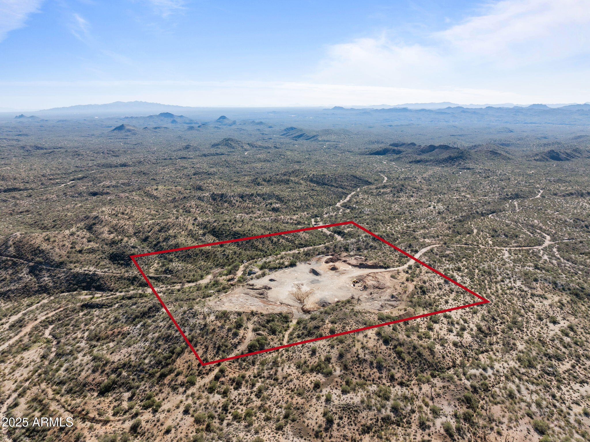 Rare opportunity to own 41.3 acres in Wickenburg, offering endless potential and unmatched privacy. An additional 20 acres just down the road is also available—ideal for establishing the main headquarters or expanding your operations. Currently used as a gravel yard, this versatile property is zoned RCU-2A, allowing for a wide range of residential, ranching, and commercial-style uses.

Enjoy gorgeous mountain views, open desert surroundings, and the benefit of being surrounded by State Land for ultimate seclusion. Property includes a private well powered by a generator, and offers plenty of room to build a main home, guest house, large shop, arena, horse barns, hay barns, or storage barns. If a homesite isn't your goal, this acreage is perfect for a storage yard, ranching setup, workshop space, or other functional uses.

Additional value comes with mining claims Prosperity Number Four & Prosperity Number One, located in the Blue Tank District (MS No. 4015).

Whether you're looking for a private ranch, investment acreage, headquarters for your operation, or a property with mining potentialthis land provides flexibility and wide-open opportunity.