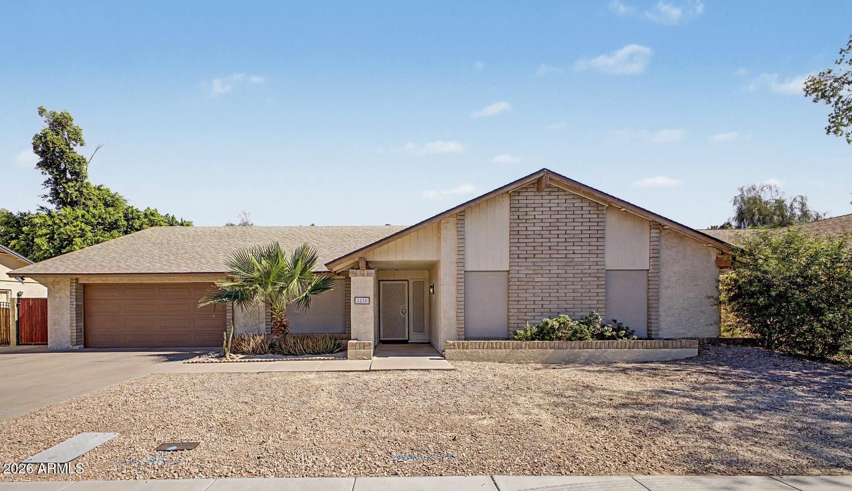 Welcome to your dream home in the highly sought-after Dobson Ranch community!This 4 bed/2 bath home offers an open floor plan with vaulted ceilings that create an inviting sense of space.The expansive family room is the perfect gathering place, complete with a cozy fireplace & wet bar for effortless entertaining.The kitchen features updated countertops, a double oven, stainless steel refrigerator, pantry, & a convenient pass-through window to the backyard, making indoor-outdoor entertaining a breeze. Step outside to your own backyard retreat, where a covered patio overlooks a pebble finish diving pool. An RV gate provides added convenience for extra parking & storage. Both bathrooms have updated countertops & double vanities.Living in Dobson Ranch means enjoying access to community pools, scenic lakes, tennis courts, parks, playgrounds, walking paths, and year-round community events. Conveniently located near the US-60 and Loop 101, you'll have quick access to shopping, dining, entertainment, and everything the Valley has to offer. This home offers the perfect combination of comfort and convenience--don't miss the opportunity to make it yours!