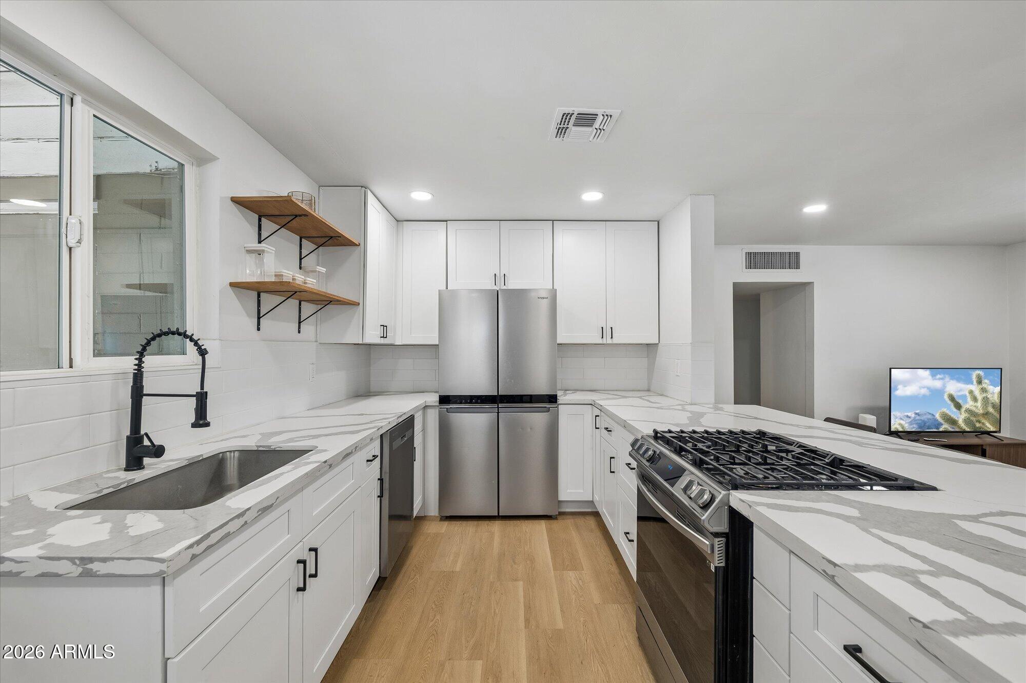 6th Ave Northwest captures the perfect blend of style, location, and livability. This 3bd/2ba home has been properly remodeled in recent years and boasts a fully upgraded kitchen with a gas range. Enjoy a massive backyard and back patio with the freedom of no HOA restrictions. You're just steps away from Melrose neighborhood favorites like Valentine, Thunderbird Lounge, and Boycott Bar. Whether you're a first-time homebuyer or looking for a low-maintenance investment in one of Phoenix's most vibrant neighborhoods, this move-in-ready gem is an opportunity you won't want to miss.