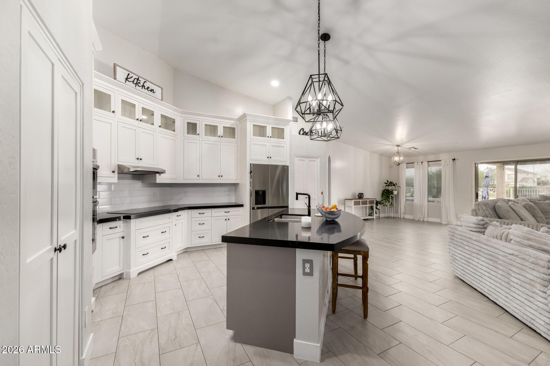Recently remodeled 2,908 sq ft home with 4 bedrooms, 2 baths, office, and a sparkling pool! Open-concept layout features a custom Stone Creek kitchen with quartz counters, new cabinets, upgraded appliances, porcelain tile, and Anderson windows and shades. Tastefully updated bathrooms, central vac, owned Kinetico water softener, new insulated garage door, and updated fixtures throughout. Private backyard oasis with new landscaping, covered patio, outdoor island, fire pit, no neighbors behind, and breathtaking Arizona sunsets. Easy I-10 access—approx. 30 minutes to Chandler and Phoenix. Move-in ready and a must-see!