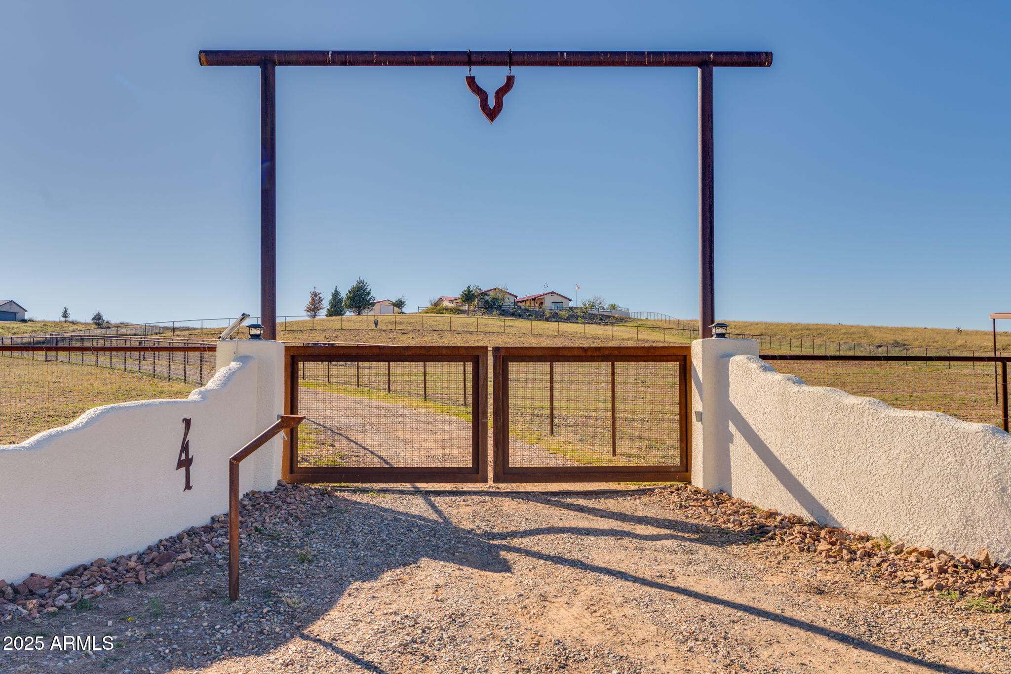 Do you dream of a custom luxury home paired with an amazing equestrian facility?  Located In Sonoita, in the heart of Arizona's stunning wine country,  the high-desert elevation of nearly 5,000 feet gifts you a perfect climate with mild summers that rarely exceed 100 degrees.  With panoramic views for days across rolling grasslands and majestic mountain ranges, welcome to 4 Mustang Trail. This exquisite 3-bedroom, 3-bathroom stunner is a rare find, perfectly positioned on 8+ acres and offering a masterful blend of refined living and a professional-grade horse property.  From the dedicated 40x60 horse stalls to the 5 fully fenced acres with top rail no climb the property also shows off its massive 20x25 custom shop.

4 Mustang Trail has been meticulously designed for those who appreciate space, custom craftsmanship, and the freedom of rural living without sacrificing convenience.This beautifully designed three-bedroom, three-bath custom home blends timeless architecture with inviting comfort. At the heart of the property lies a serene courtyard, complete with a bubbling fountain  the perfect setting for morning coffee or evening gatherings under the stars.

Inside, an open great-room design creates a bright, spacious flow ideal for entertaining or relaxing. High ceilings, rich finishes, and thoughtfully placed windows enhance the sense of warmth and light throughout. A private library nook offers a quiet retreat for reading or reflection, adding to the home's refined yet welcoming atmosphere.

This incredible  back yard was designed for year-round entertaining. The area seamlessly extends your home's footprint, providing the perfect setting for relaxing evenings or large gatherings.

For the hobbyist or collector, not only does this home have a three car garage but also has a substantial 20x25 shop with custom shelving that offers secure storage, a dedicated workspace, or a haven for your projects. This 20x25 shop is wired with three 110 circuits and one 220 circuit,  (the 220 is wired  but not hooked up). In addition, the property is equipped with dedicated, easily accessible RV/boat parking, ensuring all your toys and equipment have a safe, organized home. 

With amazing location, cooler temperatures, a gorgeous welcoming home and amenities to fit most any hobby, what are you waiting for?