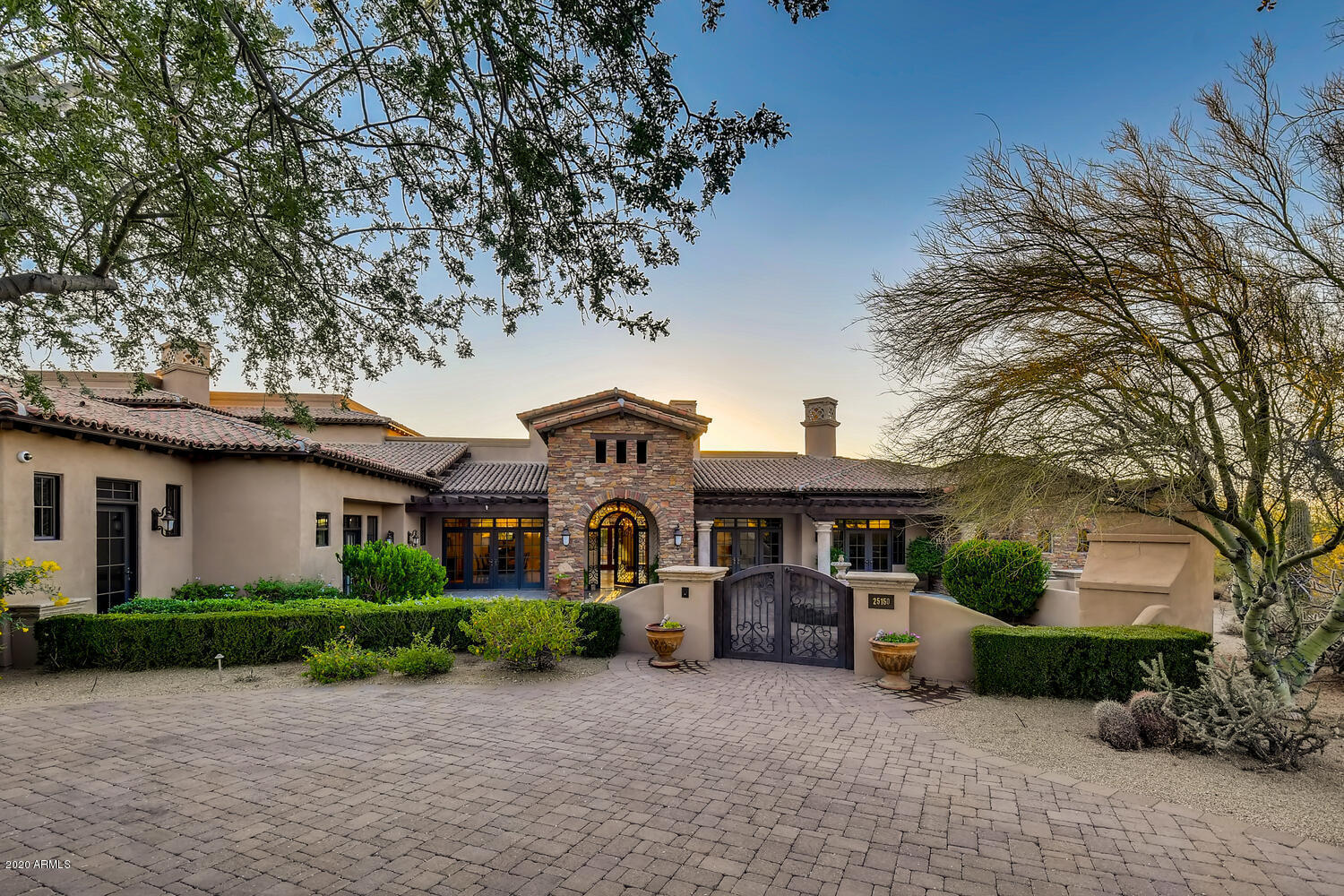 Stunning Estate home in Gated Desert Skyline Estates with Extraordinary Mountain, Sunset and City Views!! Enter through the spacious courtyard with plenty of room for entertaining around one of three outdoor fireplaces. Open floor plan features Gourmet Kitchen, TWO Master Suites, Guest quarters with a separate entrance, a Teen/Guest wing, formal and informal living and dining, Office, Exercise room, workshop and over 2,000 sq. ft. of Outdoor Covered Living space! Perfect multi-generational home or winter retreat. The craftsmanship & design details will amaze and inspire you. An Elan Smart Home controls entertainment, security, lighting, landscaping and HVAC. Close to the best Schools, Golf, Hiking, Shopping & Dining Scottsdale has to offer!