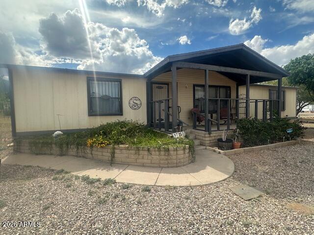 COUNTRY LIVING ON PAVED ROADS. 3bedroom 2 Bath, Large spa master bath, screen back porch. Enjoy your covered front porch Large nearly a half-acre fenced lot. Beautifully landscaped Flowers, Apple Pomegranate trees, Tombstone rose Bush Storage building, RV gate.
