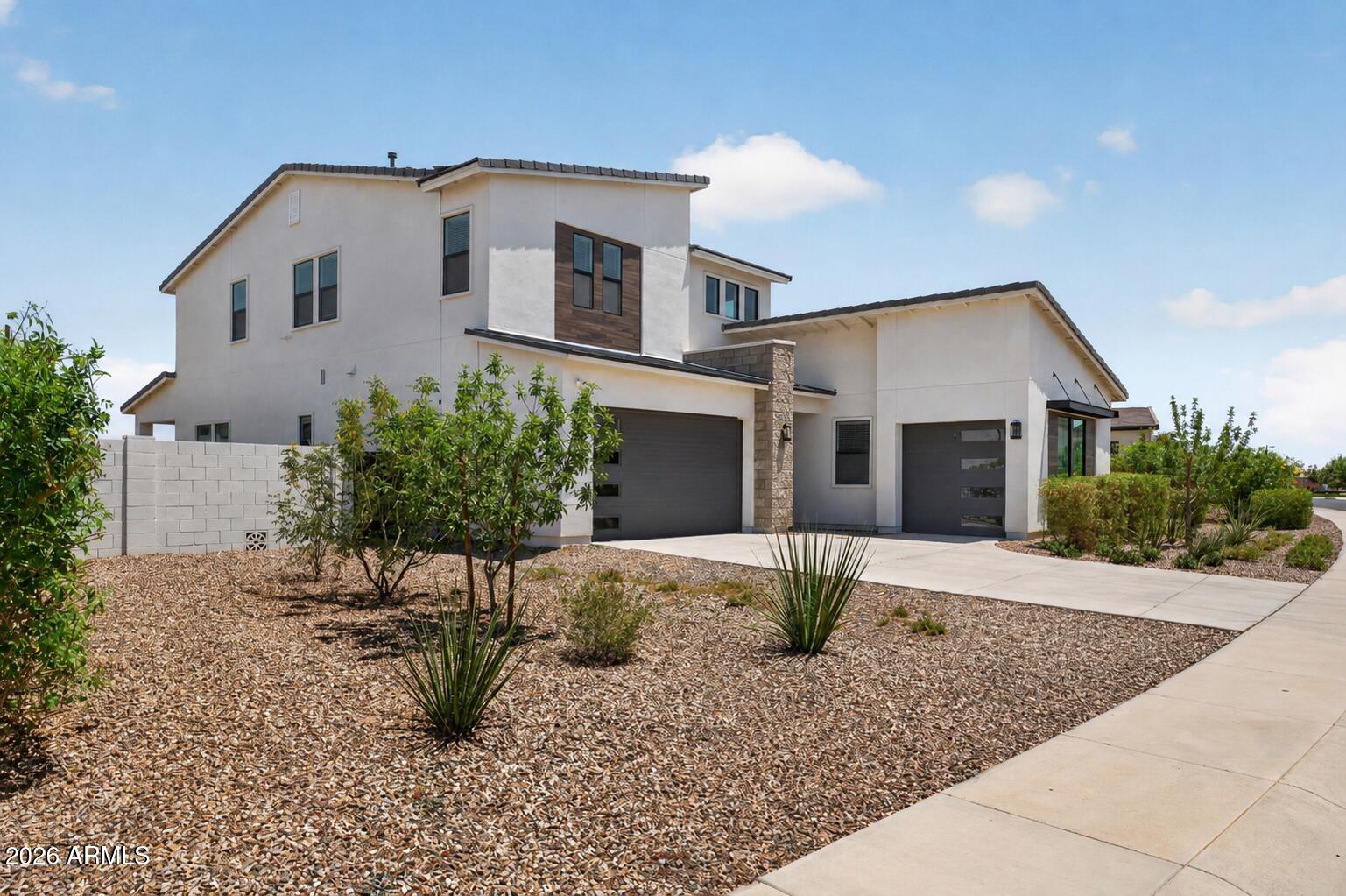 Ask about how the seller is matching builder incentives on this stunning modern Toll Brothers Savannah floor plan located on a rare 1/4-acre oversized lot- one of largest in Phase 1 - with beautiful mountain views. This spacious home features 6 bedrooms, 4.5 baths, a 3-car garage, and room to add an RV gate. With over $100,000 in premium upgrades, highlights include a first-floor primary suite, gourmet kitchen with upgraded KitchenAid appliances, custom cabinetry, designer backsplash, butler's pantry, and commercial-grade counter-depth refrigerator. Additional features include a dramatic pocket-door slider with motorized shade, upgraded iron stair railing, custom laundry room cabinetry with built-in steamer, fully landscaped backyard with real grass, custom lighting , and large dog run with pet door access. Ideally located near Queen Creek Marketplace, Olive Mill, golf, dining, and entertainment in The Preserve.