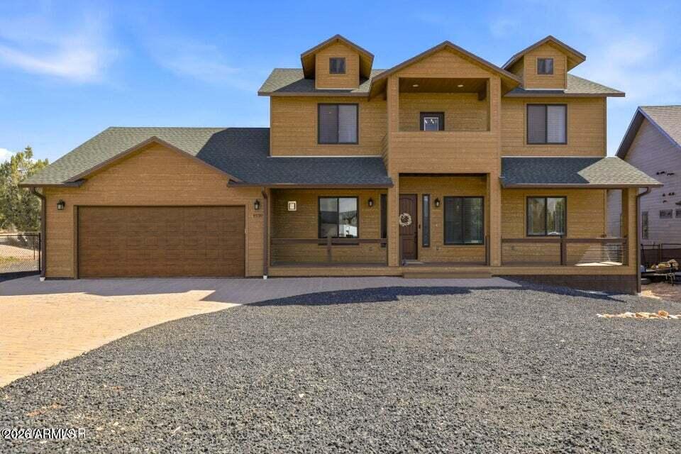 Welcome to this Whispering Trails home amidst the soaring pines of Show Low, Arizona. Modern, yet warm it invites you to step inside and embrace the brilliance and comfort it presents. The moment you walk in the stone gas fireplace in the living room will welcome you to this impressive mountain luxury home. Featuring 4 spacious bedrooms, 2.5 baths and a bonus room. The first floor invites you to enjoy the kitchen, dining room, primary suite, and half bath, the upper floor includes 3-bedrooms, a full bath, laundry utility room and bonus room with a closet that paves the way to the upper covered deck. Highlighted by the gorgeous and elevated kitchen, sleek stainless-steel appliances, a walk-in-pantry, pot filler above gas oven, and oversized island for entertaining. Welcome to this Whispering Trails home amidst the soaring pines of Show Low, Arizona. Modern, yet warm it invites you to step inside and embrace the brilliance and comfort it presents. The moment you walk in the stone gas fireplace in the living room will welcome you to this impressive mountain luxury home. Featuring 4 spacious bedrooms, 2.5 baths and a bonus room. The first floor invites you to enjoy the kitchen, dining room, primary suite, and half bath, the upper floor includes 3-bedrooms, a full bath, laundry utility room and bonus room with a closet that paves the way to the upper covered deck. Highlighted by the gorgeous and elevated kitchen, sleek stainless-steel appliances, a walk-in-pantry, pot filler above gas oven, and oversized island for entertaining. Enjoy the large kitchen

sink as you gaze through the window upon the children playing, the dogs running, or family interacting in the fully encompassed yard. The outdoors will lure you to one of the four covered decks to embrace that cool mountain breeze. As you settle into your morning coffee by the outdoor gas fireplace upon the upstairs deck, you remember why the mountains were calling.
Within the home are features like quartz countertops throughout, hardwood cabinetry with soft close drawers, oversized Anderson windows together with blinds for privacy. A dual climate control HVAC system to accommodate the first and second floor independently. The decks are equipped with Trex decking, the garage with epoxy, and interior vinyl plank flooring throughout the home for style and ease. Including two well intended laundry rooms. A washer and dryer in primary closet, and a 2-in1 washer dryer combo located in the upstairs utility room serving all your laundry needs. The large fully fenced backyard is perfect for your enjoyment; the back deck provides space for entertaining and a gas stub for grilling during warm summer nights.
4930 W Mountain Hollow Loop has been loved and well cared for, it's time to make it yours! (Security cameras and tv mounts do not convey.)