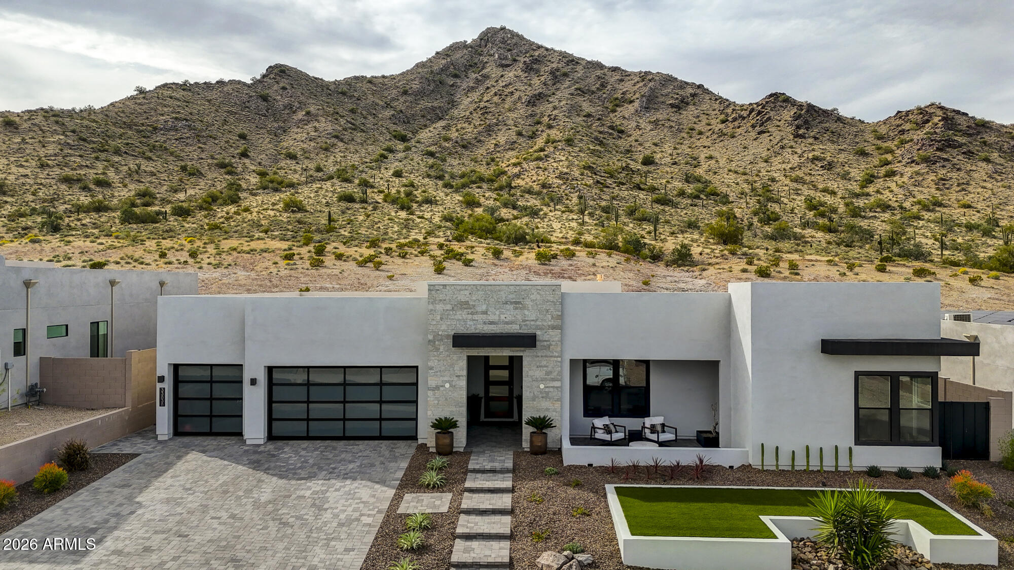 ONLY PRESERVE LOT AVAILABLE IN COMMUNITY! Welcome to this stunning 3-bedroom, + den, 3.5-bathroom home in Prelude at Oro Ridge, where breathtaking mountain views and luxurious upgrades create an exceptional living experience. Thoughtfully designed with both comfort and style in mind, this home offers elevated finishes throughout. At the heart of the home is a showstopping chef's kitchen featuring premium JennAir appliances, a built-in Sub-Zero refrigerator, triple ovens, a 6-burner gas cooktop with griddle, a built-in wine refrigerator, as well as an ice maker, sleek quartz countertops, a spacious walk-in pantry, and an oversized island with breakfast bar seating -- ideal for hosting gatherings or enjoying everyday meals. The open-concept great room impresses with striking beamed ceilings and a dramatic 16' multi panel sliding glass door that frames the breathtaking mountain views while flooding the space with natural light.  The expansive primary suite offers a serene retreat, complete with a spa-inspired ensuite bath featuring dual vanities, custom lighted mirror, a soaking tub, a beautifully tiled shower, and a generous walk-in closet. Bedroom 2 includes its own private ensuite bathroom, ensuring comfort and privacy for guests or family members. Bedroom 3 is filled with natural light from beautiful windows along with a well-appointed bathroom with a custom tiled shower, lighted mirror and stylish finishes. The den can be used as a home office, library, media room, playroom, fitness space, or even a guest retreat. Outdoors, your private backyard oasis awaits, highlighted by a stunning pool and ample space to design the ultimate outdoor retreat -- whether you envision a spa, outdoor kitchen, or tranquil desert escape!