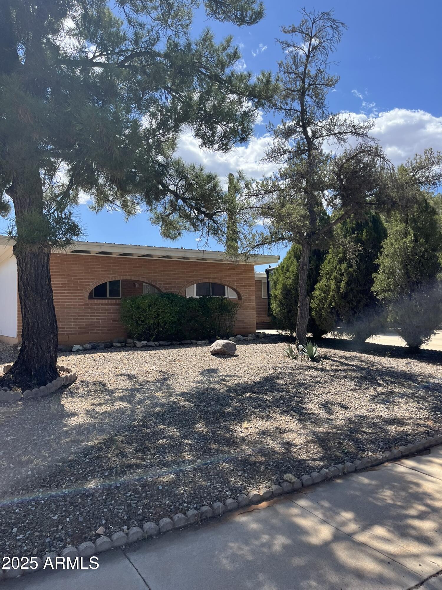 LOOKING FOR BEACH FRONT Property? Well, this is not it. However, this is a  beautiful affordable home nestled at the end of a ''no thru St.''   The home has up graded dual pane windows with vinyl frames. Elegant quartz counter tops. Soft close cabinets, stainless steel appliances. Both baths have been up graded. A laundry room with real room! Packed with cabinets. The floors are wood laminate through out most the rooms. There are fig. Chinese red date, pomegranate & Pecan trees. Both back and front yards are low maintenance. Out back there is an efficient 10,5 X 10.5 workshop. there is incredible amount of slab parking. . Plus a storage room the full width of the carport. Top off this beautiful package with a Metal roof, Who needs the beach