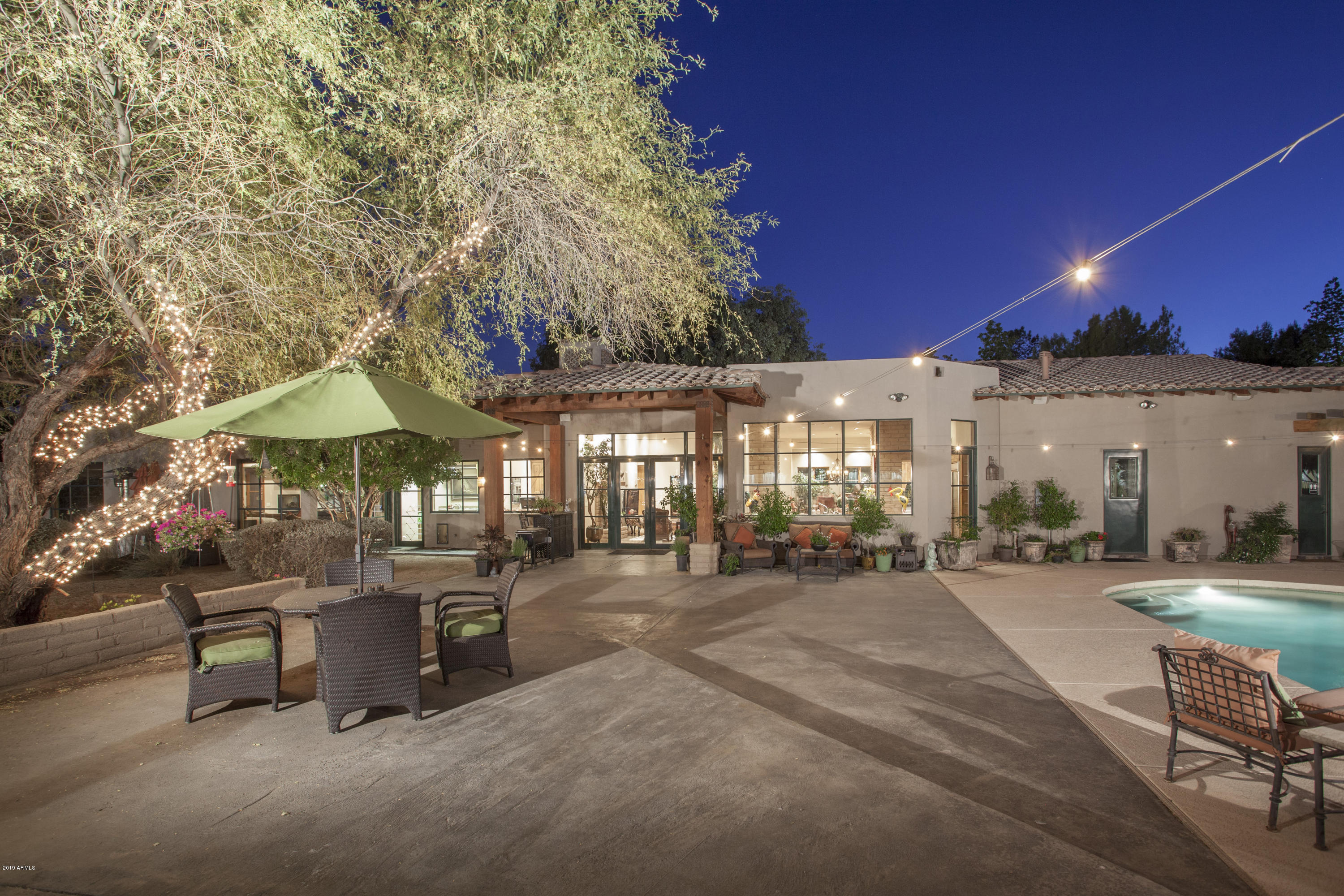 Stunning Luxury Estate in Premier Location of Cactus Corridor. Boasting 2.3 acres, this dream property offers everything a horse lover could want & more. No horses? No problem! Backyard can easily be converted into anything your mind can imagine. Home was completely remodeled in 2007 from top to bottom w/every upgrade imaginable. Beautiful stained concrete floors throughout. Chef's kitchen w/professional SS package, Dacor gas cooktop, dual ovens, granite countertops & breakfast bar overlooking resort style backyard & spacious detached office/guest house. Backyard oasis includes a sparkling pool, built-in BBQ and FP. Twenty 12x12 box stalls, auto insect repellent spray & watering along w/impressive 50x90 presentation ring & 60 ft round pen, etc.. all along side a lush grassy pasture. No HOA