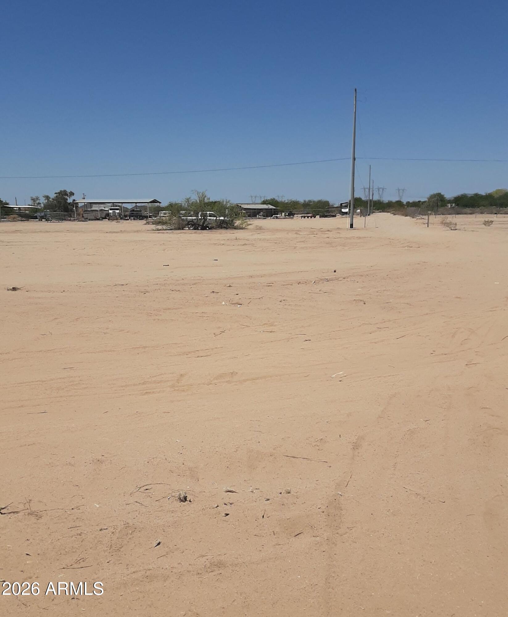 Can you hear that? No? That's the sound of peace and quiet in beautiful Tonopah, AZ. This 1.302-acre vacant lot offers the perfect canvas to build your dream home with room for horses, toys, and everything in between. Electricity is available at the lot line and a shared well is in place, making it easier to get started. Conveniently located near the I-10 and 339th Ave exit, you'll have quick access to fuel, dining, and everyday essentials -- without sacrificing that wide-open desert serenity. The property falls within a floodplain; however, the Maricopa County Flood Control District has confirmed that building is permitted with certain stipulations, and the surrounding neighborhood reflects that with established homes already in place.