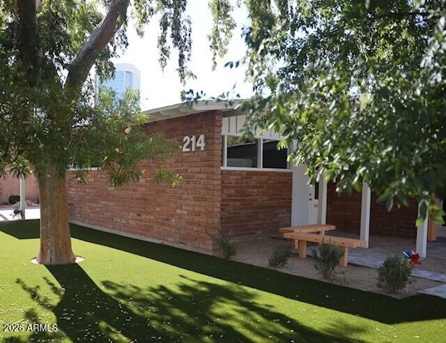 Located in the heart of Midtown Phoenix, 214 E. Monterey Way offers a rare opportunity to own a beautifully updated office building that blends historic charm with modern finishes. The striking red brick exterior carries seamlessly into the interior, preserving its timeless character while creating a warm, professional atmosphere. Large windows fill the space with abundant natural light, complementing the flexible layout of private offices and collaborative work areas. The property also features 13 dedicated parking spaces and provides exceptional access to SR-51, Downtown Phoenix, the Camelback Corridor, and nearby restaurants and amenities.