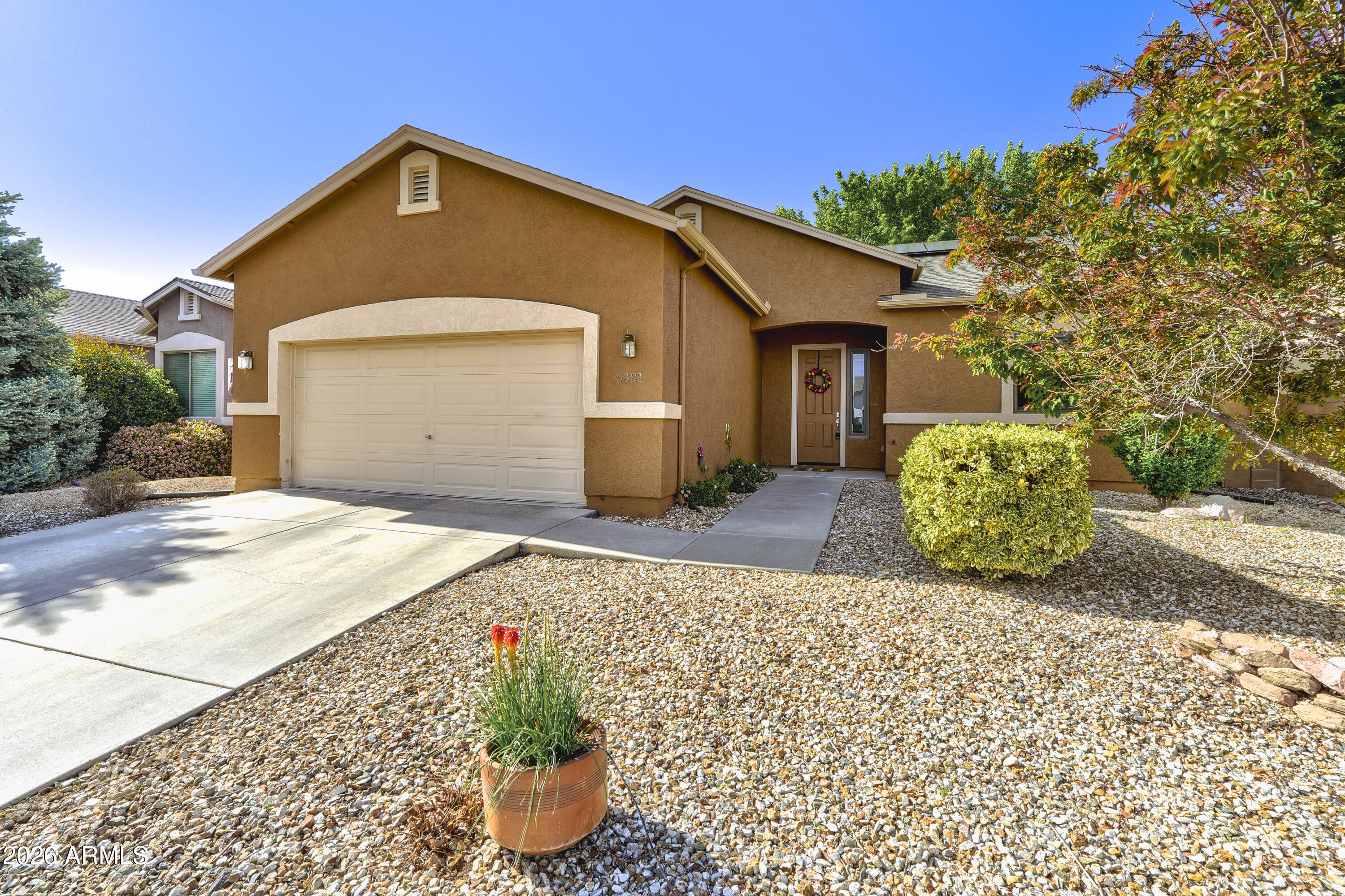 More than a home, this is an opportunity to enjoy the lifestyle that makes Granville one of Prescott Valley's most sought-after communities. With parks, pools, fitness facilities, walking paths, classes, and community events nearby, you'll enjoy amenities designed for every stage of life. This move-in ready home combines comfort, convenience, and energy efficiency. The solar and electrical panels have been upgraded to support an electric vehicle while continuing to reduce your overall utility bill. The spacious kitchen features an expansive walk-in pantry and overlooks the great room, creating a natural gathering space for family and friends. The generous primary suite includes a walk-in closet and a relaxing jetted tub, while the covered patio and low-maintenance backyard provide the perfect setting for outdoor enjoyment without the burden of extensive upkeep. You'll be close to shopping, dining, medical services, schools, parks, and recreation. Whether you're looking for a family-friendly neighborhood, a low-maintenance retirement lifestyle, or a home that offers modern energy-saving features, this property delivers exceptional value and everyday convenience. Ideal for buyers seeking a low-maintenance home in Prescott Valley, retirees looking to downsize without sacrificing amenities, or anyone wanting the benefits of community living with modern energy-efficient features.