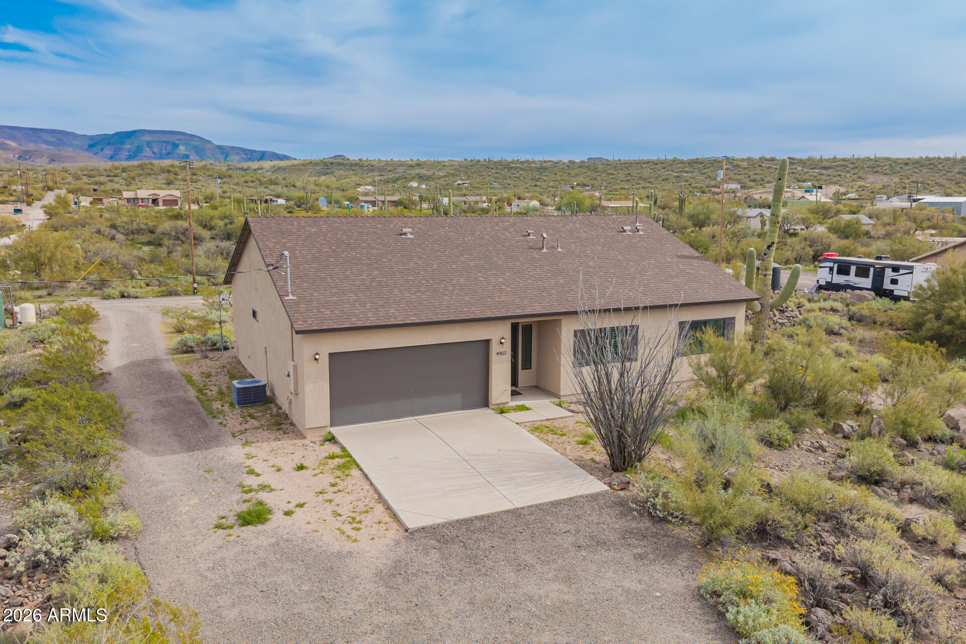 FEELS LIKE A NEW HOME! Gorgeous 3 bed/2 bath/2 car garage with FANTASTIC mountain views in all directions! AMAZING home for the price on an acre lot in New River. Vaulted Ceilings in the Great Room. Kitchen features Maple Cabinets, Granite Countertops, Satin Nickel Hardware, Stainless Appliances and Island. Brand new carpet & interior paint! Tile just professionally cleaned. Recent equipment on private well. All electric home. Spacious Laundry Room with space for Fridge/Freezer. Water Softener. Come enjoy the peace & quiet in rural New River!