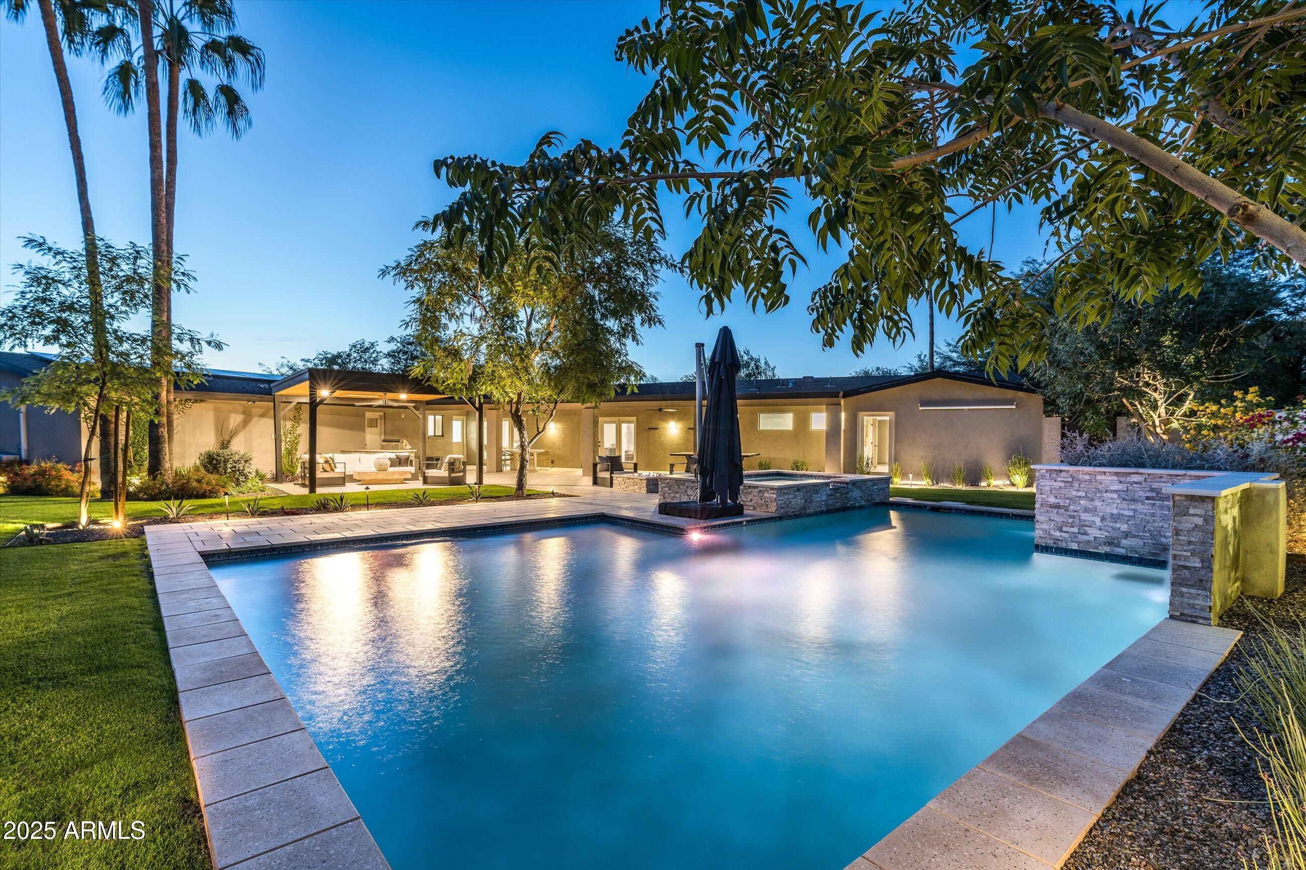 Experience breathtaking Camelback Mountain views from every angle in this modern desert sanctuary, perfectly situated on a generous 0.68-acre lot. This home blends timeless design with contemporary upgrades, featuring brand-new hardwood floors, fresh crisp paint, and owned solar for energy-efficient living. Step outside to your private resort-style retreat complete with a new custom pool and spa, built-in BBQ, and panoramic views of Camelback Mountain. The yard also features a custom pergola with commercial grade heaters for cool evenings, 220v outlet to accommodate a sauna, and outdoor projector screen. Whether you choose to take in the views from the front patio's cozy dual-sided fireplace or the backyards tranquil poolside firepit, every destination here is an entertainers dream. Located in the highly sought-after Scottsdale Unified School District, zoned for Hopi Elementary, Ingleside Middle, and Arcadia High School.

Just minutes from The Global Ambassador, Steak 44, The Henry, Buck & Rider, and all the luxury resorts of Scottsdale and Paradise Valley, this home offers the perfect blend of modern elegance, sustainability, and iconic desert living.