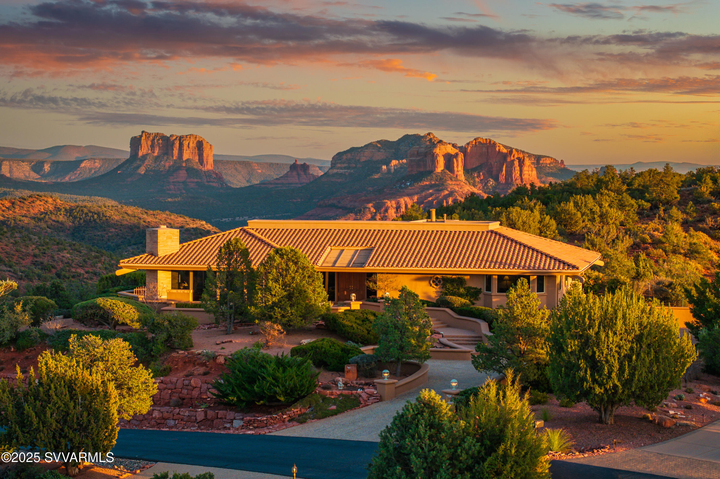 Perched on the highest hilltop in a premier gated community and bordering national forest, this home offers the BEST VIEWS in all of Sedona from sunrise to sunset. Enjoy unparalleled red rocks and Mingus Mountain scenery with unsurpassed privacy. Designed with superior craftsmanship, the main level features a luxurious primary suite, office, den (or 4th bedroom), a gourmet kitchen, and a great room with a stunning gas fireplace, all opening to expansive outdoor living. A private pool, veggie garden, and four-car garage complete this retreat. The adjacent lot is available separately with first right of refusal to purchase.

This exceptional Sedona estate is a rare opportunity to own a home with unparalleled views, the quality of a Don Woods home, and absolute privacy. The lower level features a complete in-law master suite with a kitchenette and private patio, creating the perfect space for guests, extended family, or a private retreat.

The primary bedroom suite offers a spa-like bath and two walk-in closets; a built-in custom office space; gourmet kitchen provides high-end appliances; great room boasts soaring ceilings and walls of glass capturing panoramic red rock views. A perfect home for entertaining or peaceful relaxation.

The outdoor spaces are equally impressive, featuring a private swimming pool, a charming veggie garden, and multiple patios to take in the ever-changing colors of Sedona's iconic landscape. The home also includes a four-car garage with ample storage.The property borders the pristine national forest, offering direct private gated access to hiking and nature's tranquility. 

For those seeking even more space, privacy, or investment potential, the adjacent 1.03-acre lot (Parcel 408-11-279) is available for purchase separately. Valued at $790,000, this premium parcel offers endless possibilitiesfrom securing additional privacy to building a second home or guest estate. Buyer will have first right of refusal.

This is a rare opportunity to own a true Sedona masterpiecewhere elevated living, refined craftsmanship, and breathtaking natural beauty converge.

Offered at $3,250,000
Please note: No short-term rentals permitted. One-year minimum lease required.