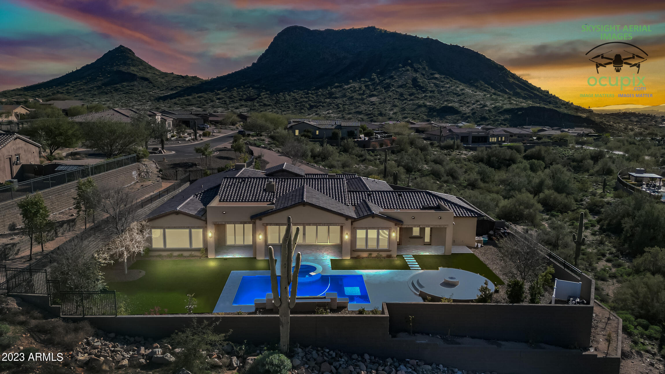Brand New Custom Home Just Completed! This executive, hillside home was designed for privacy and entertaining. Long, winding, circular driveway, with over 10k ft. of pavered drive gives this estate a 5 million $ feel. Not one detail left out of this stunning masterpiece with courtyard entry with a sep entrance casita. The architect nailed this phenomenal split, open floor plan. Soaring 12 ft. ceilings allow for the right natural light and dramatic Mtn. views from every room. Massive great room adjacent to the gourmet kitchen, fit for a chef, flows nicely through the 24' expansive glass sliding doors. The private, resort rear yard with refreshing custom pool and heated spa is set up for entertaining large gatherings. Extensive hardscape/landscaping package along with retaining walls. WOW
