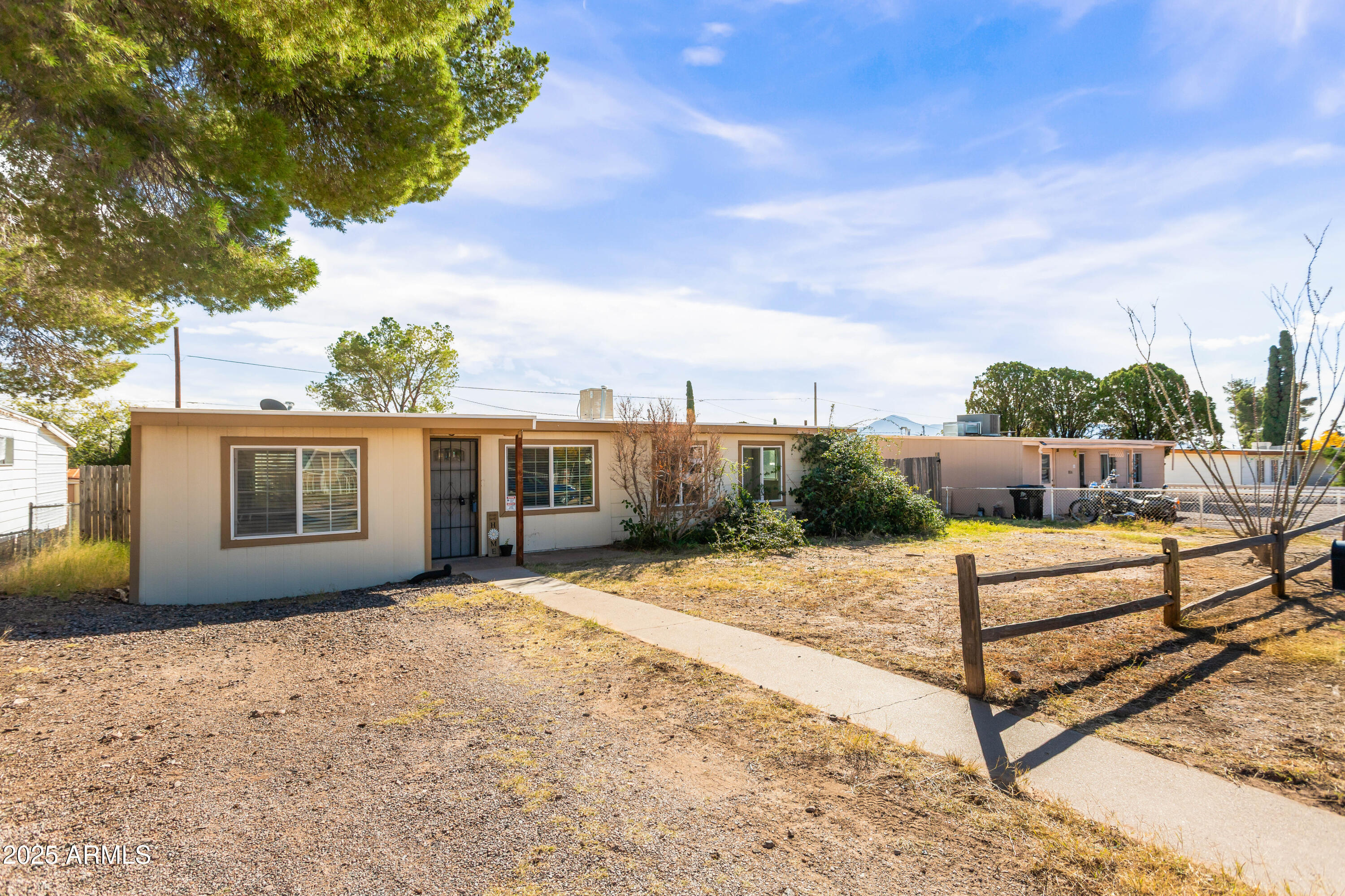 Affordable and move-in ready! This charming 3-bedroom Bisbee cottage was remodeled in 2021 and has a brand-new 2025 roof. Enjoy a fully fenced yard for privacy. Inside, the original living room opens to a bright, spacious great room with plenty of natural light. Make this lovely home yours!