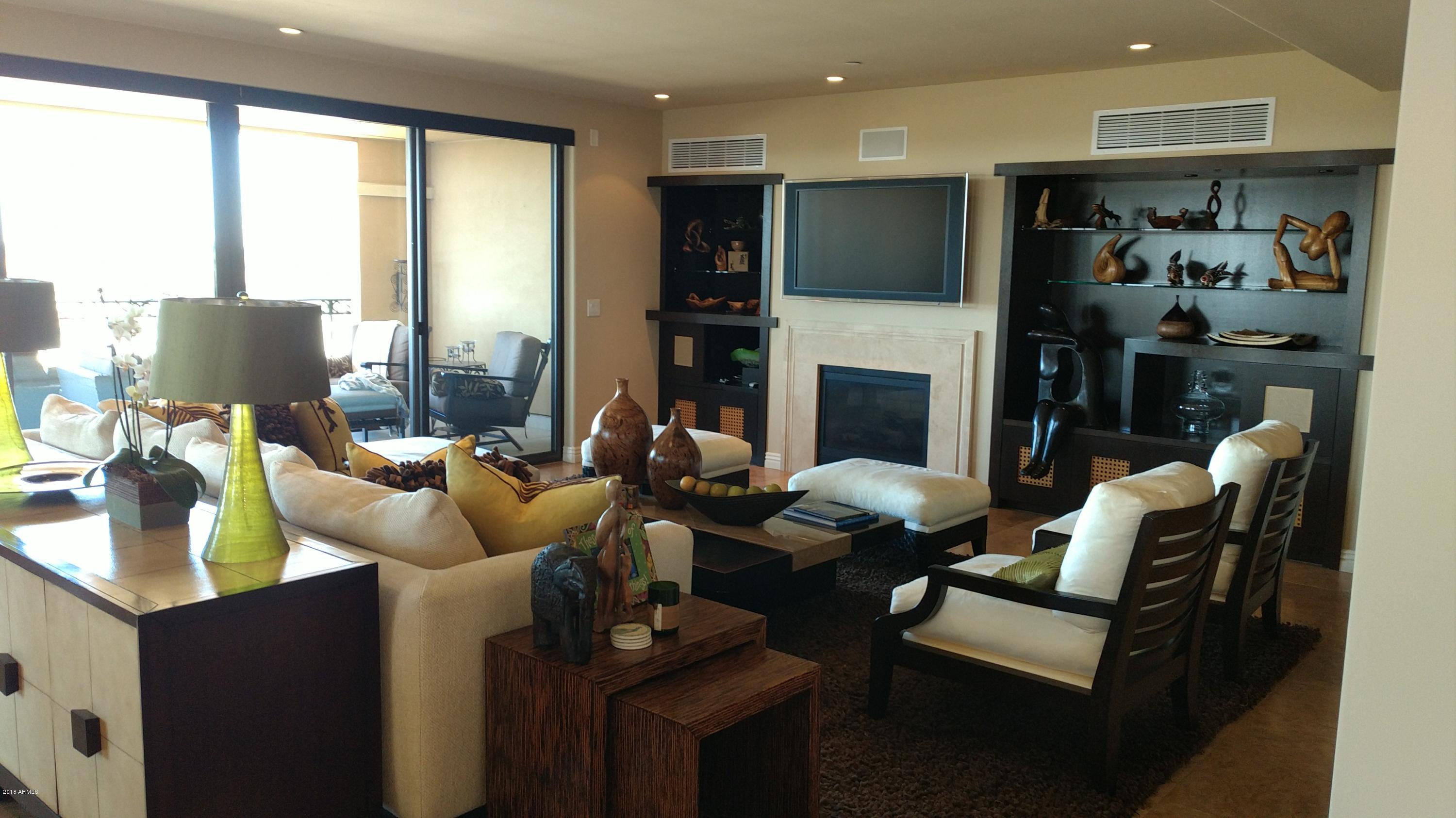 This one of a kind 3 bedroom 3.5 bath unit at the Scottsdale Waterfront boosts beautiful views in every direction. The unit wraps around the entire southern end of the building overlooking the canal and Papago Mountains to the South, Red Rock, Four Peaks and Superstition Mountains to the east and Camelback Mountain  to the west. This beautiful unit has two balconies, east and south.  The homes pristine condition features an optimal flow and split floor plan. The home has a many custom features that include upgraded flooring, granite counter tops, a European designed built in bar, kitchen, book selves, all with every detail attended to. Private parties can be held in the entertainment room with preparation in the Chef's kitchen. Make sure to take in the majestic views from the roof top pool and spa. All within walking distance to premier shopping, galleries, restaurants, nightlife and waterfront fitness. This home is too good to miss.