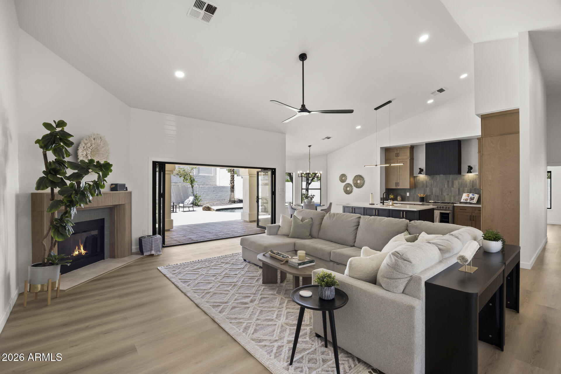 Completely redesigned and thoughtfully updated, this 5-bedroom, 3-bath home in Ahwatukee delivers modern style, functional space, and true indoor-outdoor living.

From the moment you walk in, you're greeted by soaring ceilings and a massive open-concept layout built for entertaining. The brand-new kitchen features a large island, all new stainless steel appliances, a gas range, and flows seamlessly into the great room.

The split floor plan offers privacy, highlighted by a fully reimagined primary suite with a spa-style bathroom, oversized walk-in shower, soaking tub, and a spacious walk-in closet.

A 12-foot multi-slide door opens to the backyard, creating a seamless extension of the living space. Outside, you'll find a covered patio, outdoor kitchen and bar, heated pool, lush grass mountain views, set up perfectly for Arizona living.
Additional features include a 3-car garage and a large finished storage space above the garage.
This is the kind of home that stands out the second you walk in.
It's like nothing else in town, check it out today!