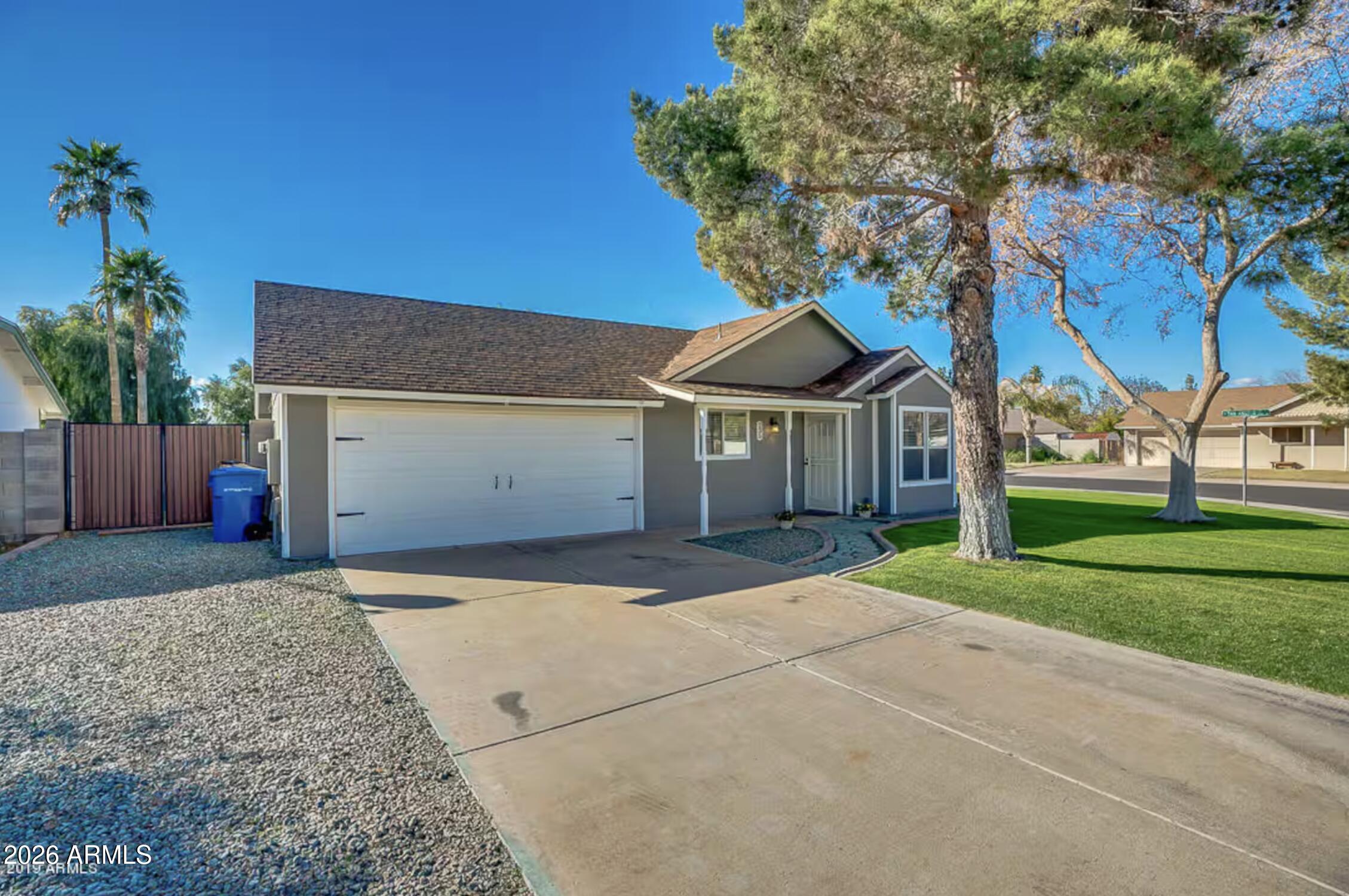 Honey, Stop the Car!!! What an Adorable Dollhouse with No HOA and only a mile to Downtown Gilbert! Large corner lot with mature trees and grass in both front and back yards.  Well thought out floor plan feels bigger than noted sq. ft. When you walk in you will feel like you are home. Welcoming front living room, a spacious Eat in Kitchen will Granite Counters, white raised panel cabinets and Stainless Steel Appliances. 3 nice size Bedrooms, 2 Full Baths, and a large 2 Car Garage. RV Gate so bring your RV or toys and park in your own side yard. There is a Covered patio and a large storage Shed too!