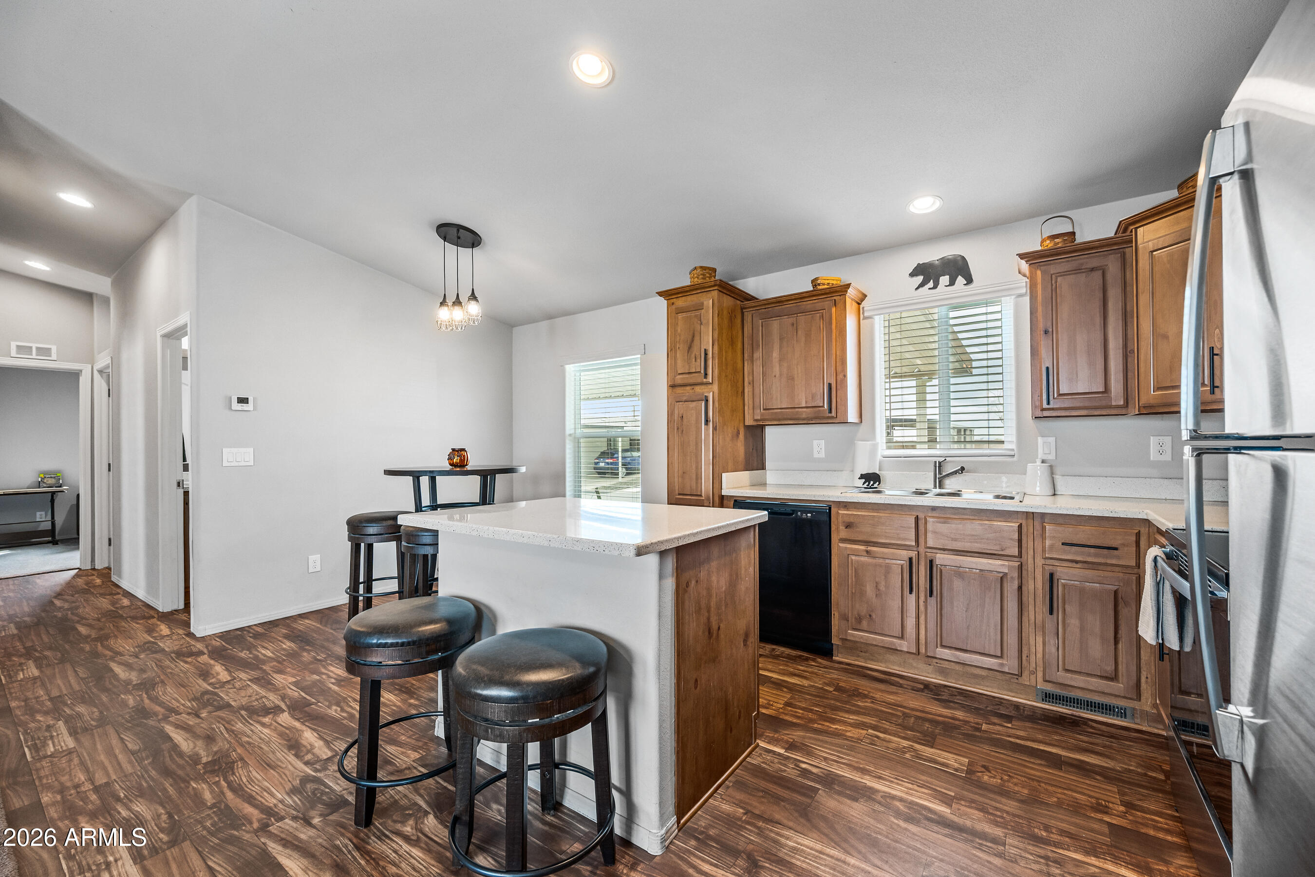 MOTIVATED SELLER! Welcome to Cotton Lane Resort, a vibrant 55+ community in Goodyear! Situated on a corner lot, this 2 bed, 2 bath 2025 double-wide offers a cozy, simple design ideal for those who live actively but want an easy place to retreat and recharge. Enjoy single-level living with no interior steps, laminate flooring, recessed canned lighting throughout, and a bright, functional layout. Built with R-40 roof insulation for excellent energy efficiency, this home was designed for comfort. Indoor laundry and a covered two-car carport add everyday convenience. With resort amenities and typically more affordable living than many comparable parks, this is active adult living made simple.