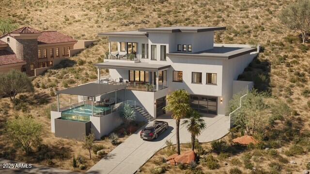 Let us start your dream home process today! This architectural showpiece is ready to build. VIEWS, VIEWS, VIEWS! Thoughtfully integrated into the hillside, this modern desert home embraces clean lines, expansive glass, and multiple outdoor spaces—each framing sweeping panoramic vistas. Offering 4 bedrooms and 5.5 baths, it features a gourmet chef's kitchen, stunning view decks, and a luxurious primary suite that delivers both comfort and drama. The highlight is the negative-edge resort pool that blends seamlessly into the horizon for a truly striking setting. Just minutes from Arrowhead Mall, top dining, and major sporting venues, this home brings together tranquility, style, and total convenience. with convenience. This is an extraordinary opportunity to own a one-of-a-kind luxury home in the desert foothills ready to begin construction now.