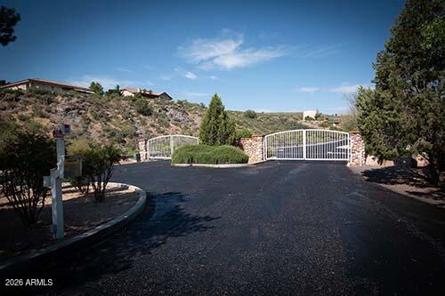 LOT 136. Float poolside while your home is under construction. Build your Next Home in this private gated community 25 minutes from
Prescott Valley, 10 minutes from I-15 and less than a hour to Phoenix. This is an ideal work from home or retirement location. Midway between Flagstaff
and Phoenix, makes this the ideal location and weather. Enjoy mountain views of sunrise/sunset. All utilities to lot: electric, water, sewer. Lot borders
BLM land for maximum privacy and views.