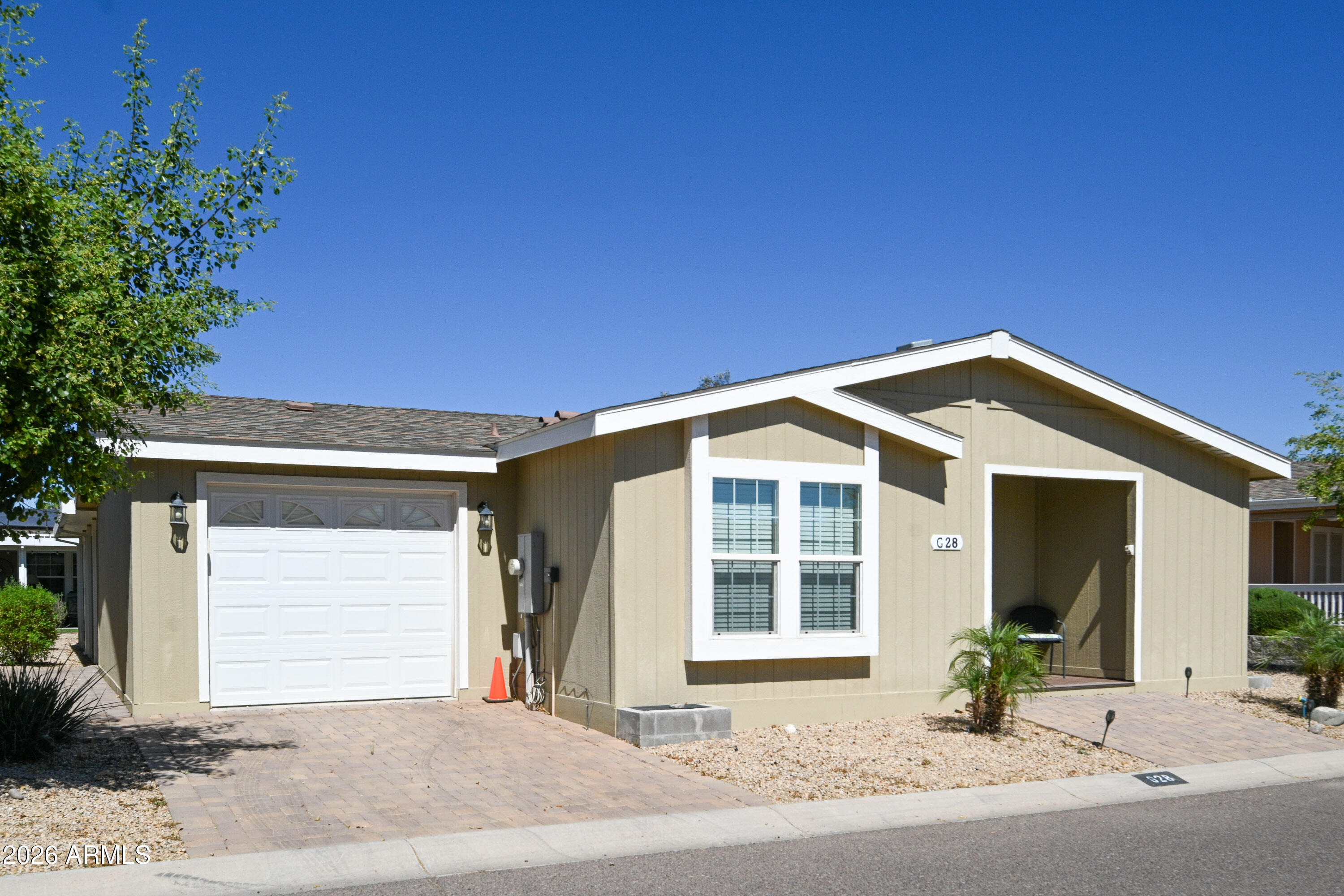 ON LEASED LAND:

Step inside this absolutely stunning 2 bedroom 2 bath 2020 Cavco home.  Barely lived in.  Fully furnished!! Just bring your personal items.  Spacious open kitchen opens to the front room, perfect for entertaining.  Large Covered patio for morning beverage or entertaining.  Plus a 1 car garage.  Home is located in the Greens.  

Pueblo El Mirage offers many amenities, such as an 18-hole championship golf course, 26 pickleball courts, tennis courts, dog parks, heated pool, lawn bowling, billiards room, workshops, onsite post office and more!