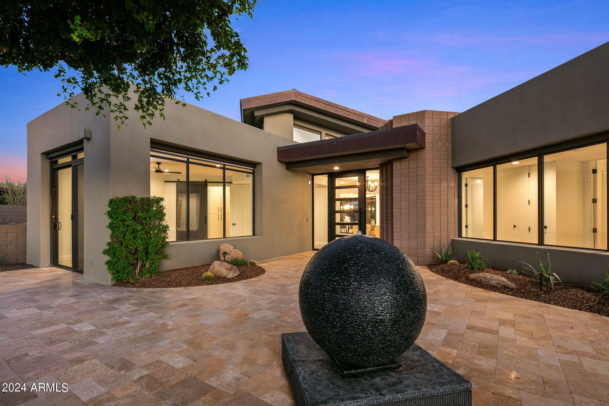 Spectacular renovated home on the 8th green of the Apache Course. The Katie Mueller design team carefully chose a sophisticated desert palette in every room. Generous outdoor living areas grace the front and back of the home. You are greeted with a large courtyard area with a spherical water feature and huge views to the southwest. The interior has no steps and flows nicely from room to room. The remodel features an added bathroom, an expanded bath and a new kitchen pantry. A Wolf/Sub Zero appliance package compliments the fine oak cabinetry in the gourmet kitchen. Fantastic views to the South from the kitchen and back patio. A new dual sliding door enhances the space. New opportunities for temporary Lifestyle/Seven membership to the Desert Mountain Club for approved applicants