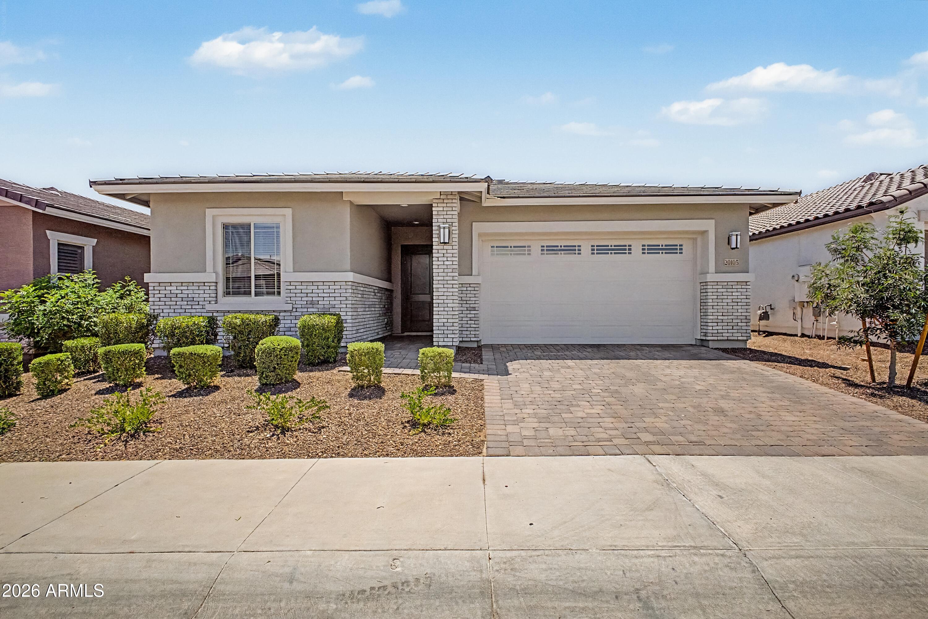 This exquisite home features 1943 sq feet of living space with 3 bedrooms, 2 baths and a large office. You will be amazed with the quality of all the finishes. The spacious kitchen features an island for entertaining, tile backsplash, gas cook top and quartz counter tops. The home has upgraded laminate wood flooring in all the right areas, custom two-tone paint the list goes on. The great room has electric roman shades for all windows and sliders.  The office has custom barn doors and a shiplap accent wall.  Relax in the backyard that features synthetic grass, fire pit area and travertine pavers. Also the home has a tankless water heater and water filtration system.