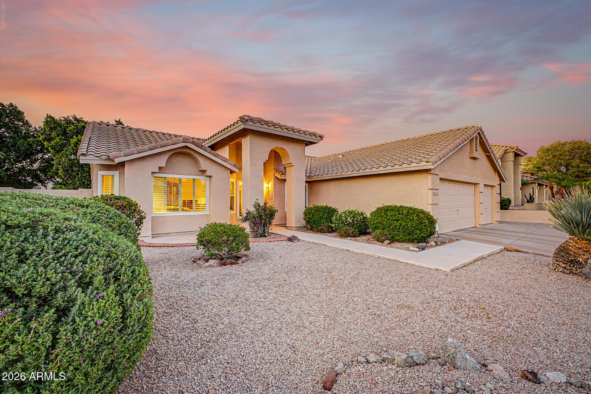Welcome home to this beautifully maintained single-story residence in the sought-after golf community of Red Mountain Ranch. Step inside to a bright, open floor plan with a spacious living and dining area that flows into the inviting family room with soaring ceilings and a cozy wood-burning fireplace. The well-appointed kitchen features granite countertops, stainless steel appliances, abundant cabinetry, and a charming bay-window breakfast nook. The spacious primary suite includes dual sinks, a separate tub and shower, and a generous walk-in closet. Two additional bedrooms and a full bath provide comfortable accommodations for family or guests. Recent upgrades, including new windows and a two-year-old HVAC system, add comfort and peace of mind. Step outside to your private backyard oasis with a covered patio, built-in BBQ, low-maintenance synthetic turf, and plenty of space to relax or entertain. The spacious three-car garage is equally impressive, featuring epoxy floors, attached storage cabinets, and ample room for vehicles, hobbies, and organization. Beyond the home, enjoy the exceptional lifestyle Red Mountain Ranch offers. Nestled at the base of Red Mountain, this premier master-planned golf community features beautiful desert scenery, mature landscaping, and access to the renowned Pete Dye-designed Red Mountain Ranch Country Club. Just minutes from Usery Mountain Regional Park, the Salt River Recreation Area, Saguaro Lake, shopping, dining, and Loop 202, you'll enjoy hiking, biking, kayaking, tubing, boating, and an easy commute throughout the Valley. This is Arizona living at its finest.