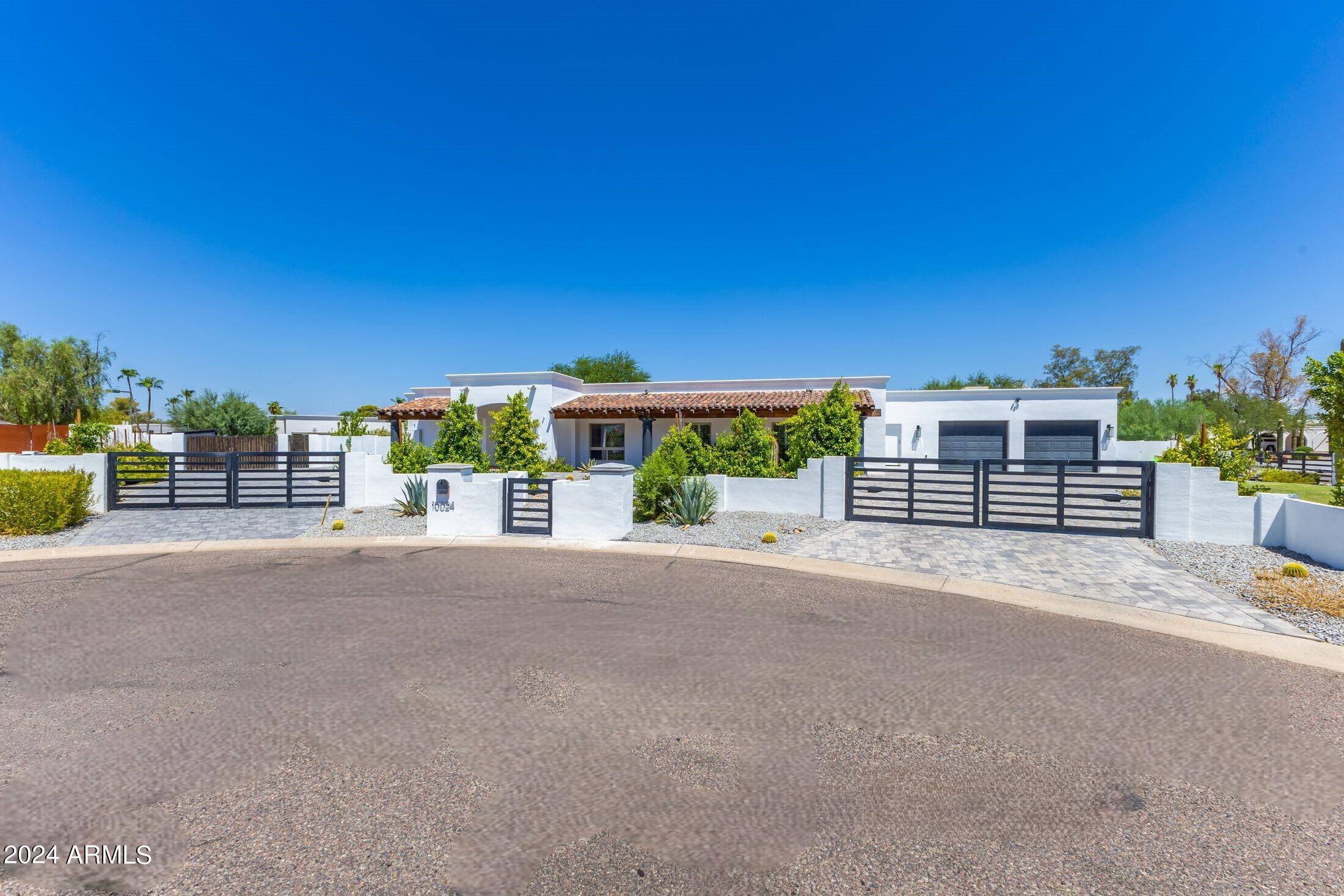 This bright happy home has been fully remodeled and expanded to include a separate detached two room guest house, and a separate detached office. This tasteful up to date home is not just esthetically pleasing, but also very functional. The main house has a large master suite, a two room junior master suite, and three additional bedrooms along with an additional bathroom and a powder room. The large laundry room is just off the kitchen. And, the great room/kitchen looks out into the large backyard and pool area. There are multiple play areas, including a sport court. The exterior rooms include a large covered patio area with an exterior kitchen, and a gazebo with a fireplace. In addition, the garage has an evaporative cooler and two electric car outlets.  Also equipped with solar panels.