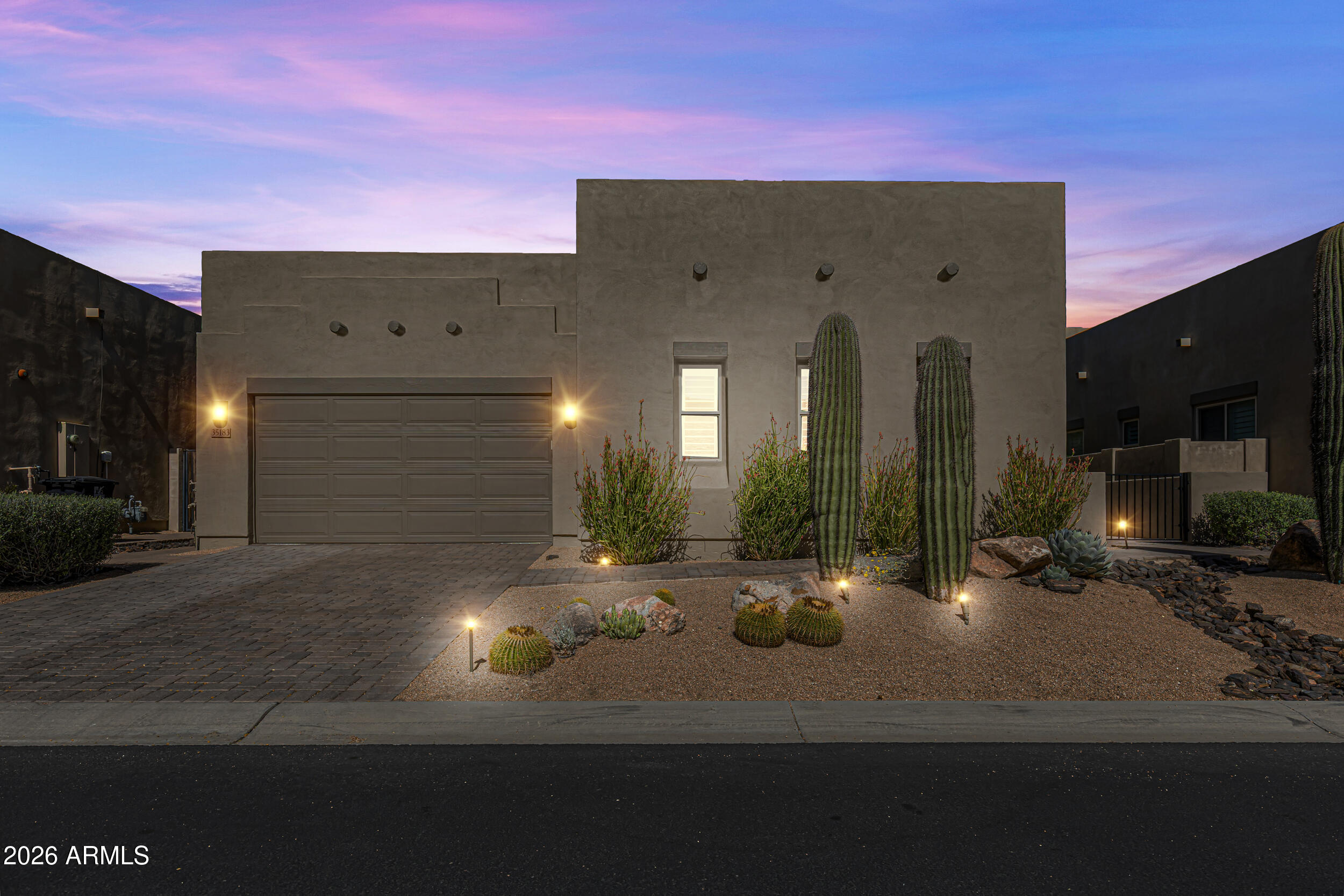 Nestled on a premium golf course lot within the exclusive gated Enclave on 8th community in North Scottsdale near The Boulders, this exceptional contemporary desert residence offers breathtaking golf course, mountain, and Sonoran Desert views with unforgettable sunsets. Built in 2018 and hardly lived in, this single-level home features 3 bedrooms, 3 bathrooms, office, workout room and 2,615 square feet of thoughtfully designed luxury living.

The open-concept floor plan showcases soaring 12-foot coffered ceilings, abundant natural light, plantation shutters, a outdoor firepit, and seamless indoor-outdoor living with expansive glass doors opening to a resort-style backyard. Designed for entertaining, the outdoor space offers a covered patio, fire features, boulders, pavers, and privacy. Nestled on a premium golf course lot within the exclusive gated Enclave on 8th community in North Scottsdale near The Boulders, this exceptional contemporary desert residence offers breathtaking golf course, mountain, and Sonoran Desert views with unforgettable sunsets. Built in 2018 and hardly lived in, this single-level home features 3 bedrooms, 3 bathrooms, and 2,615 square feet of thoughtfully designed luxury living.

The open-concept floor plan showcases soaring 12-foot coffered ceilings, abundant natural light, plantation shutters, outdoor fireplace and seamless indoor-outdoor living with expansive glass doors opening to a resort-style backyard. Designed for entertaining, the outdoor space offers a covered patio, fire features,, multiple seating areas, and privacy.

The chef's kitchen is beautifully appointed with Wolf and Sub-Zero appliances, premium granite countertops, a large island, and custom cabinetry with rollout shelves. A split floor plan provides privacy, highlighted by a luxurious primary suite with spa-style bath, soaking tub, walk-in closet, and serene views, plus a spacious guest en-suite and flexible third bedroom/office.

Additional features include smart-home capabilities, interior light and ceiling fan package, energy-efficient construction, an extended storage or workout room, plantation shutters, electronic shade screens, telescoping doors, travertine pavers, landscaping boulders, and close proximity to world-class golf, dining, hiking, and all that North Scottsdale has to offer. Gated, private, views and newer construction.
