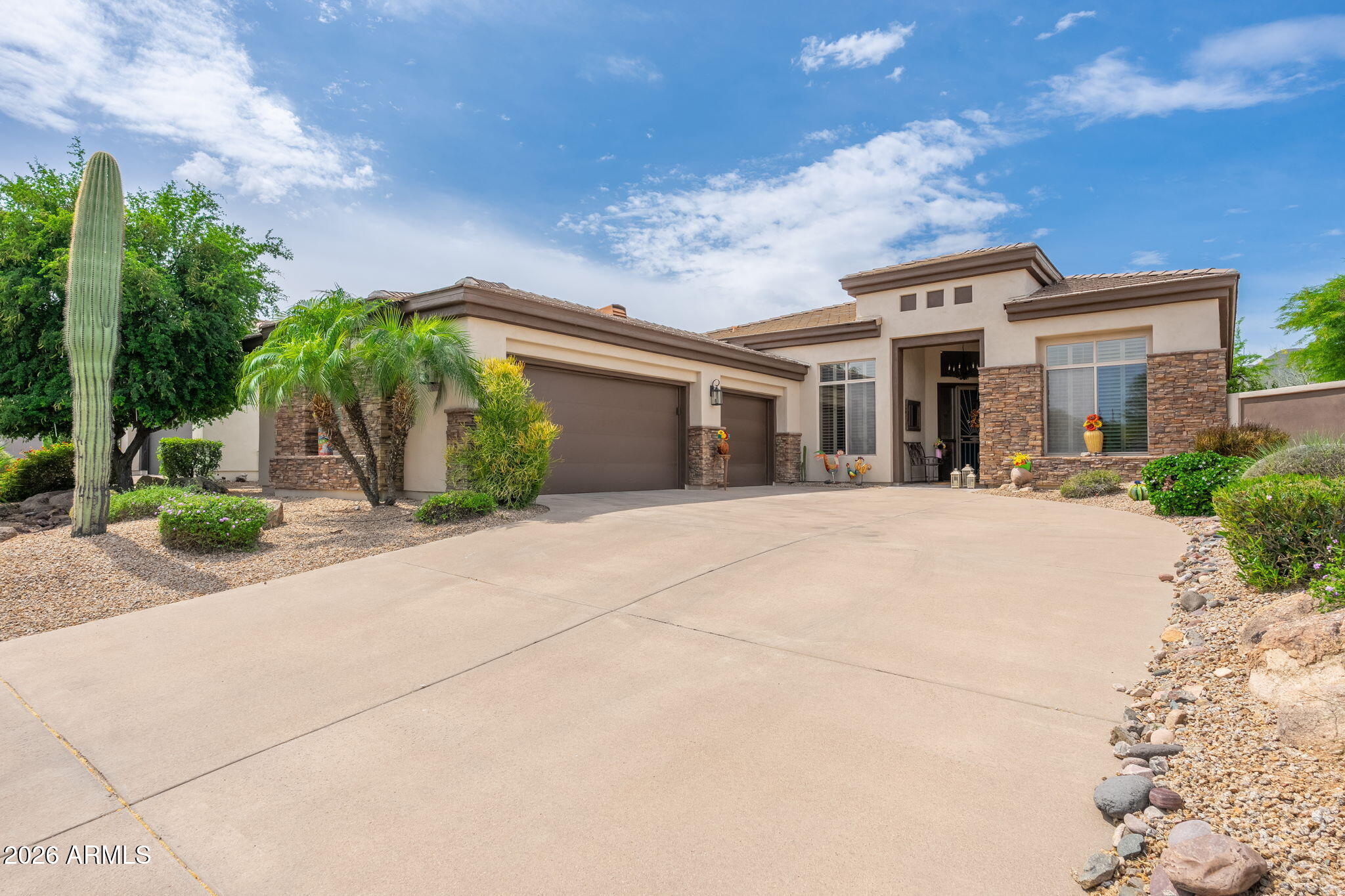 MUST SEE the Light New Interior Paint and  Staging.  So much has been updated. Within the highly sought-after community of Sunridge Canyon in Fountain Hills, this home showcases the most desirable original floor plan in the neighborhood. Designed with connection in mind, the floorplan revolves around a spacious great room that naturally brings friends and family together. This recently updated kitchen opens directly to the great room, featuring a generous breakfast bar--perfect for entertaining guests.  The home offers two primary bedrooms plus a third bedroom, all thoughtfully split for privacy yet connected through the central living space. Oversized dual-pane windows and a large sliding glass door flood the home with natural light, creating a seamless transition to the backyard (more) Step outside to an oversized lot centered around a heated play pool, surrounded by beautifully landscaped grounds and private walls for added seclusion. The covered patio is designed for year-round enjoyment, complete with a misting system and a timed awning--making outdoor dining and entertaining effortless. Adding even more value is the spacious three-car garage with abundant built-in cabinet storage--perfect for keeping everything organized while still having room for vehicles, tools, and toys.