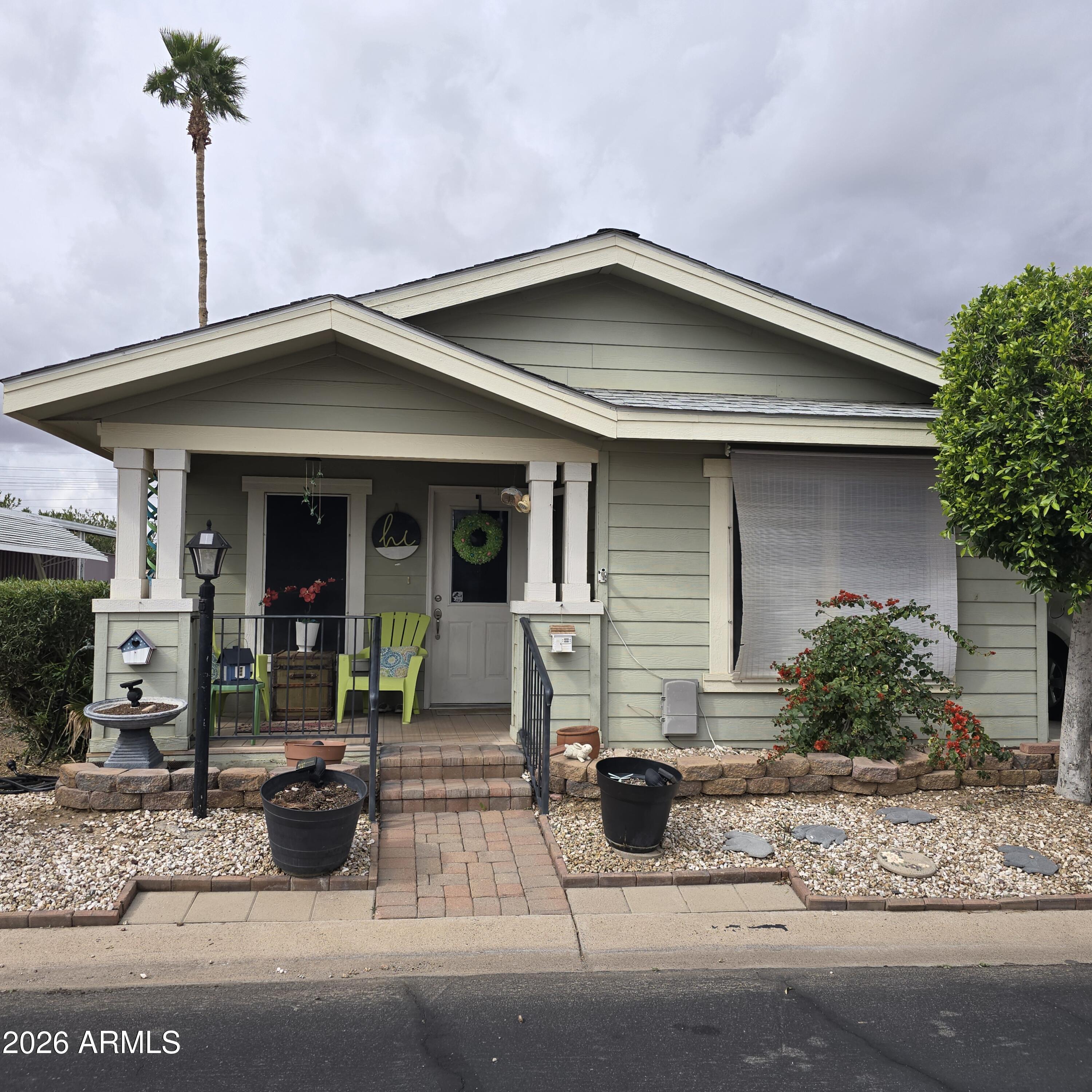 ON LEASED LAND; Dont miss out on this 2006 2 bedroom 2 bath with a den/office.  Vaulted ceilings.  Large kitchen with all appliances convey, inside laundry both washer and dryer convey.  Both bedrooms are good size with walk in closet in primary.  AC, hot water heater and dishwasher replaced approximately 2024/2025
Large storage attached shed.  Enjoy the mornings on your country porch.  Large carport.

Located in a 55 plus age restricted gated community.  Lots of activities.  Including putting green, dog park, shuffleboard, billiards and more.
