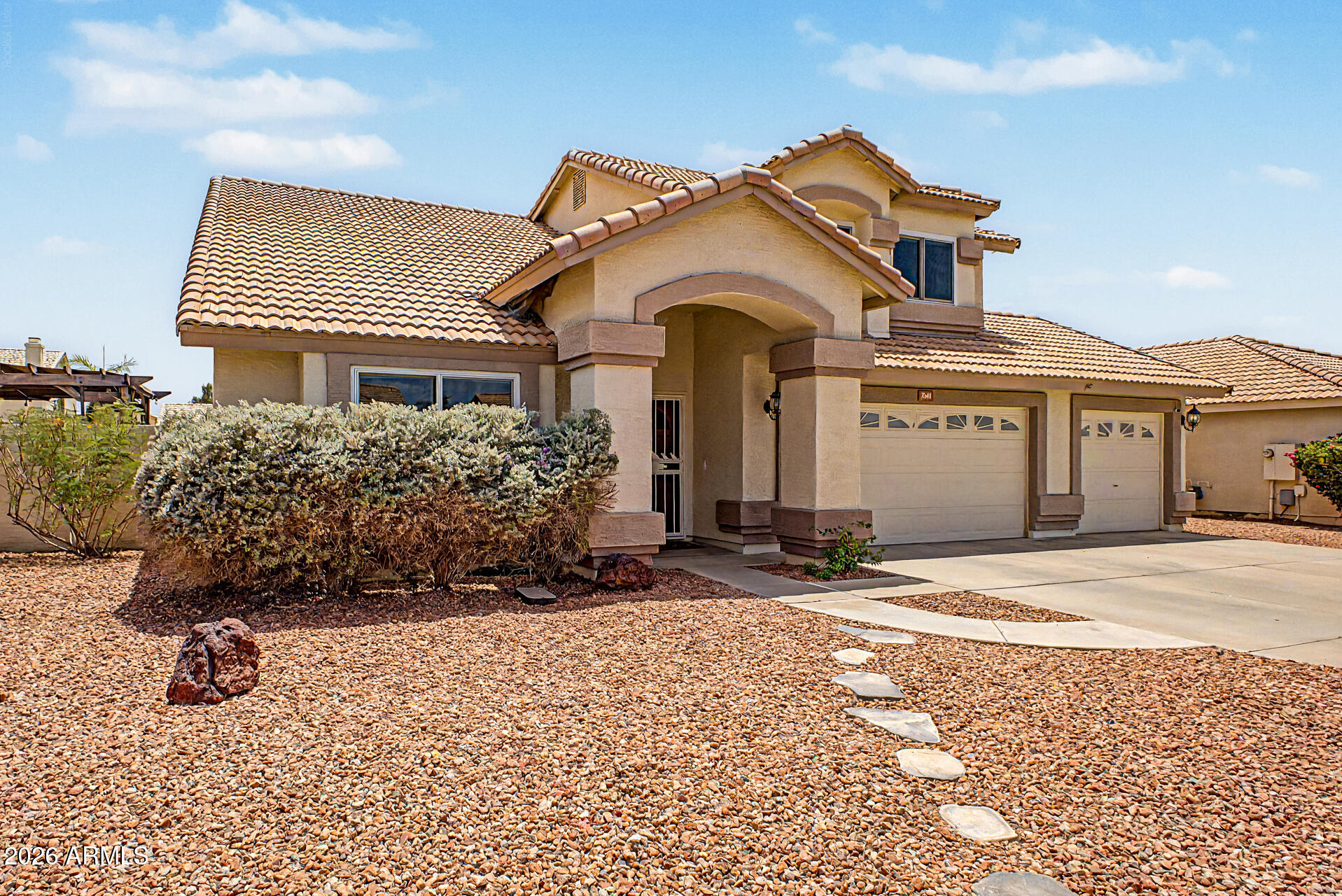 Fall in love with this stunning two-story home in the sought-after Lions Gate! The manicured landscape, 3-car garage, and RV gates are just the beginning. The interior showcases a spacious layout with wood-look flooring, carpet in all the right areas, soaring vaulted ceilings enhancing the space, a fireplace in the family room to add warmth,  and a neutral palette throughout. Prepare delicious meals in the well-appointed kitchen, complete with oak cabinetry, tile backsplash, granite countertops, stainless steel appliances, and an island with a breakfast bar, perfect for meal prep and quick bites. The primary bedroom is a true retreat, offering a fireplace to ensure cozy winter nights and a bathroom with double vanities and a separate shower & tub. The den is perfect for a hobby area or workspace. Out back, your oasis awaits, including a covered patio ideal for morning coffee and weekend grills, a grass area, a shed for added storage, a paver seating area with a pergola, perfect for relaxing with your favorite drink, and a sparkling pool for a refreshing time! This gem truly has it all! Don't miss it!