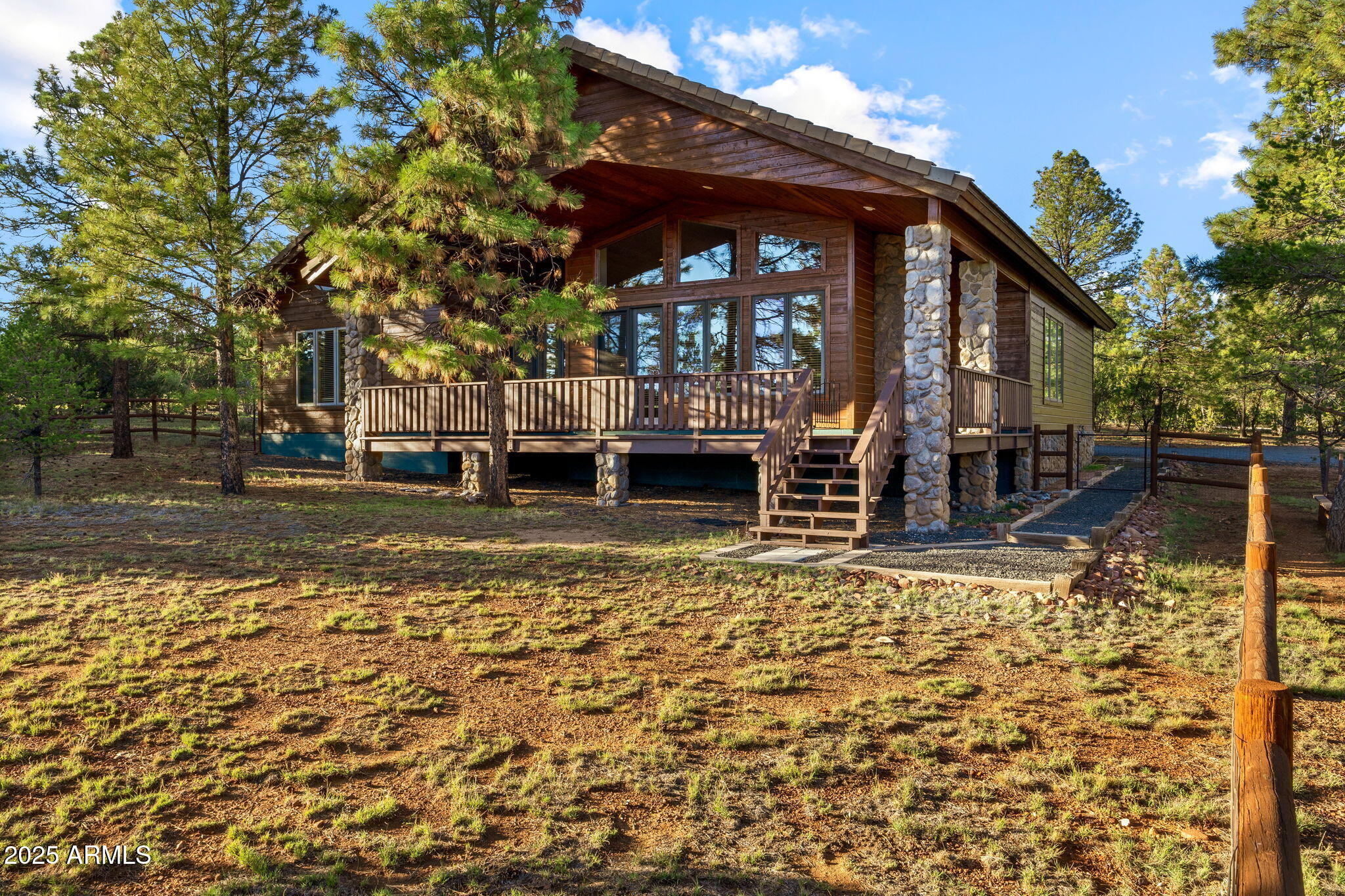 This beautifully crafted custom chalet features high-quality construction and thoughtful design in every detail. There are two master suites, each with walk-in closets and private dressing areas, offering comfort and privacy for owners and guests alike. The vaulted ceilings allow the large custom-designed windows to let in abundant light and views of the lovely pines. The quartz stone flooring and stone-faced fireplace add coziness. The kitchen features elegant granite countertops and lovely knotty alder cupboards. It is fully equipped with premium appliances such as a Viking gas range, a Sub-Zero refrigerator, and even a bread warmer. The two-car garage is oversized and offers storage galore! Outside, enjoy the fresh mountain air from the covered deck and fenced back yard. Located close to National Forest for hiking or off road vehicles.