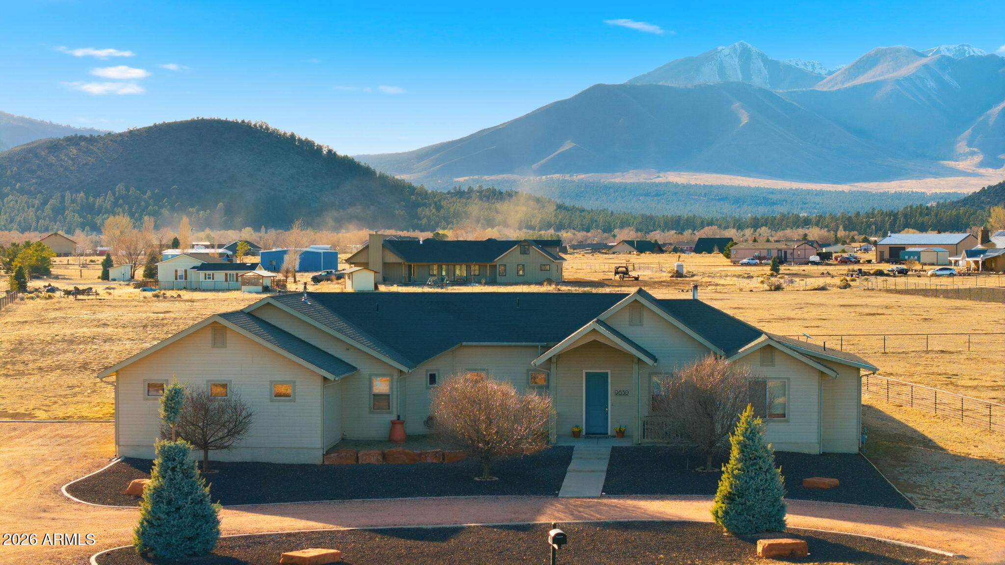 Forget the cookie-cutter. Welcome to a Flagstaff custom home that showcases Northern Arizona's beauty with sophisticated, thoughtful updates. This is a high-performance sanctuary on a 2.26-acre lot where the views do the heavy lifting and the interior does the impressing. Inside, you will immediately notice soaring vaulted ceilings and an interior that was completely reimagined in 2023. The carpet has been removed to embrace sleek, modern tile throughout every bedroom and bathrooms. The entire home, ceilings included, received a fresh coat of paint in 2023, creating a bright, cohesive canvas for your art collection.
The kitchen is primed for a chef, anchored by a suite of stainless Frigidaire appliances (Dec 2023) and framed by custom window coverings, including some premium blackout blinds for those lazy Sunday mornings.
Yes, the "bones" matter. This home has been maintained with a "no-expense-spared" attitude:
Climate Control: Brand new furnace (Jan 2025) and New AC (July 2023). Peak comfort, zero worries.
Privacy: A 6-foot treated cedar privacy fence (Feb 2023) surrounds the property.
Connectivity: A massive horseshoe driveway with an RV hookup and an oversized two-car garage (because your toys deserve a home, too).

The backyard is set for entertaining. Imagine summer nights on the extended patio and walkway, centered around a firepit area for those relaxing evenings under the starry, dark sky scene. The lawn is lush, green, and fully supported by an in-ground irrigation system with a smart timer.

For the hobbyist, we've included two raised garden containers with dedicated irrigation and a spacious storage shed. And because we like to make life easy, the push mower stays with the property.

Then, there's the backdrop. Look out over your 2.26 acres to the wide-open land beyond, offering a rare sense of scale and privacy. Whether you're watching the monsoon clouds roll in or the stars over the unobstructed view of the San Francisco peaks, the view here is the main event.