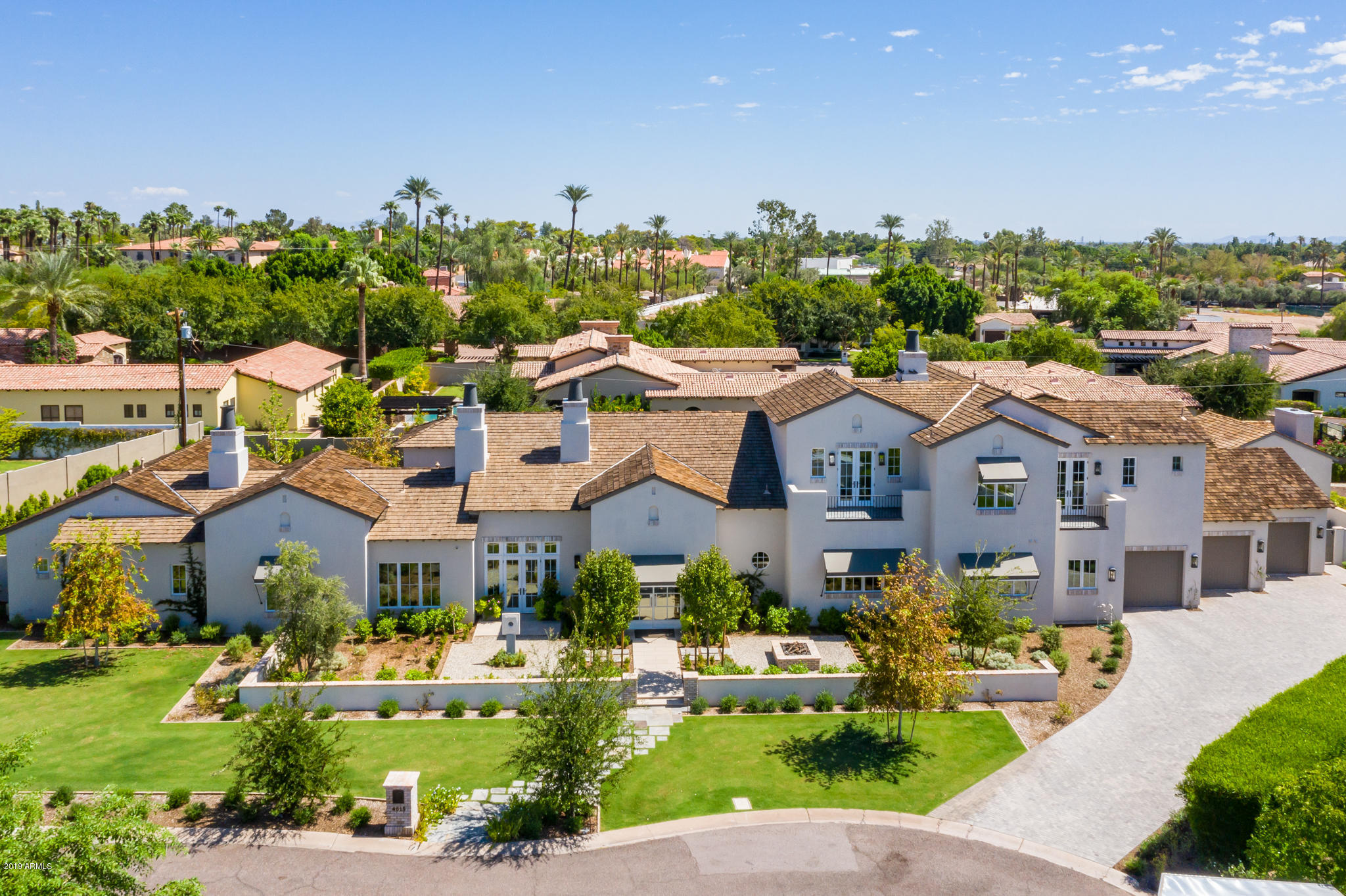 Grandeur of Arcadia! In all its magnificence this grandiose Estate redefines grace & elegance. Every detail designed to be aesthetically charming. Built in 2015 on a cul-de-sac 3/4 acre lot with striking Camelback Mountain views. This palatial modern farmhouse style estate features 5 bedrooms/5.5 bathrooms/ 6,080 square feet of opulence. Separate his & hers offices, 3 car garage, separate guest house/pool house, lush green outdoors with crystal blue sparkling pool. A ravishing home to revel in for a lifetime! See details of upgrades in document tab and home's Motion Video under photo Tab.