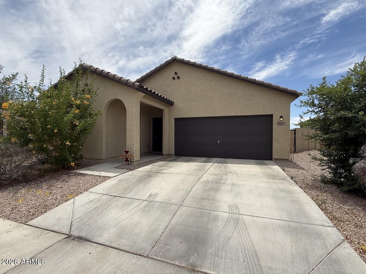 Beautiful Home in a Highly Desirable West Valley Location! Features countless upgrades such as 9' ceilings, Shaw 17x17 Tile, Granite countertops in the kitchen. Whirlpool Stainless steel appliances including gas range. White shaker cabinets. Energy-efficient features throughout, WIFI & programmable thermostat. Spacious walk-in closet in owners suite. Front yard landscaping, covered patio in the backyard. Spectacular Mountain Views! Minutes from Verrado in a master-planned community featuring greenbelt, neighborhood park with playground, and soccer field. Conveniently located near the I-10 and 303, top-rated schools, shopping and dining! Walking distance to Frys Grocery Store and Restaurants!