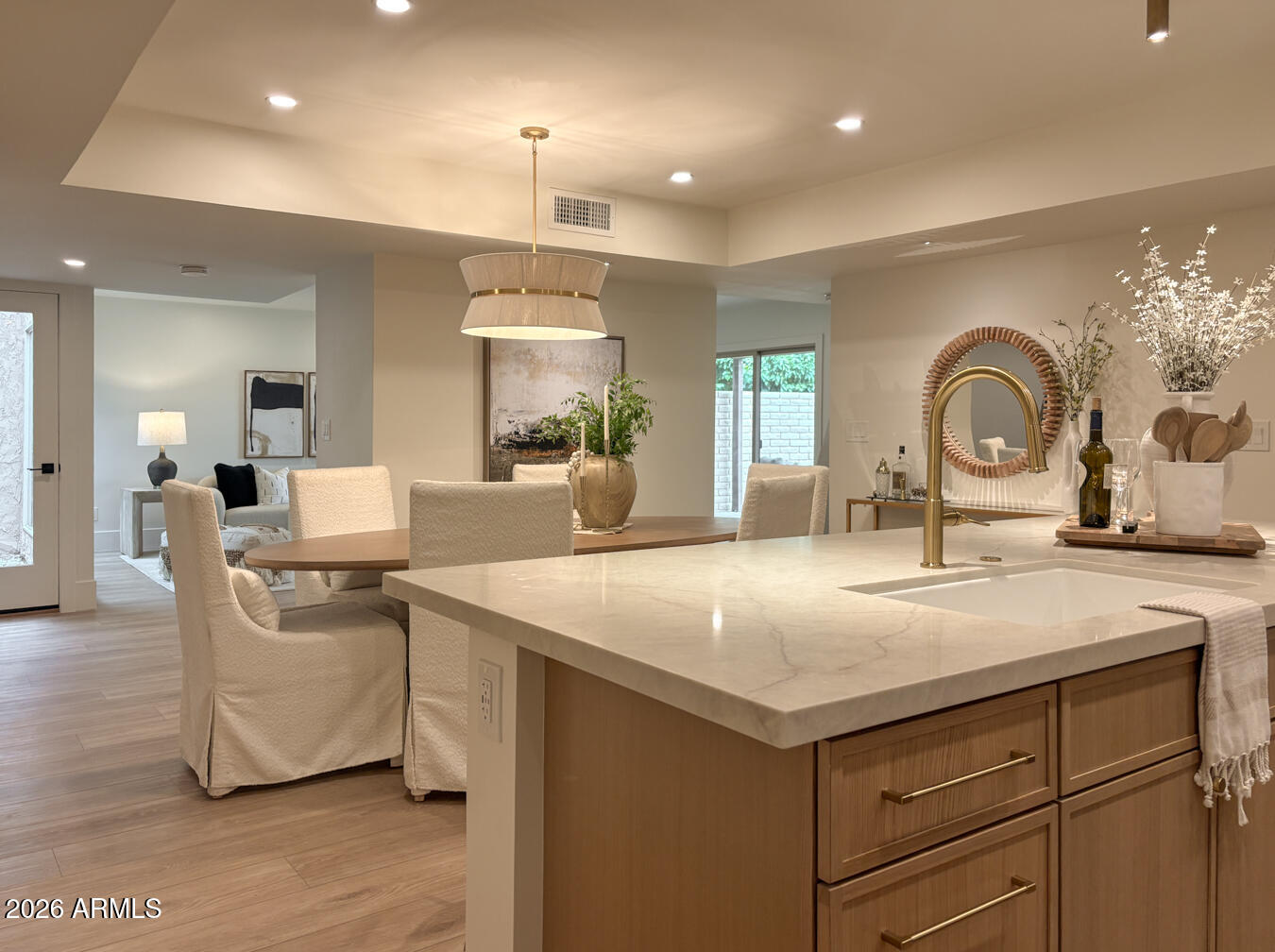 Beautifully remodeled with timeless, designer-inspired finishes, this move-in ready townhouse offers the perfect blend of style, comfort, and convenience. The thoughtfully updated interior features a custom IN-UNIT walk-in laundry/pantry with a new stackable washer and dryer, a new water heater, and a 2022 HVAC system. Enjoy a quiet morning on your private patio, then head out to the nearby greenbelt, lakes, dog park, and miles of walking and biking paths. Just minutes from Old Town Scottsdale's renowned dining, shopping, golf, and entertainment. This is true lock-and-leave living--ideal as a primary residence, seasonal retreat, or investment property. Thoughtfully renovated. Beautifully designed. Completely turnkey.