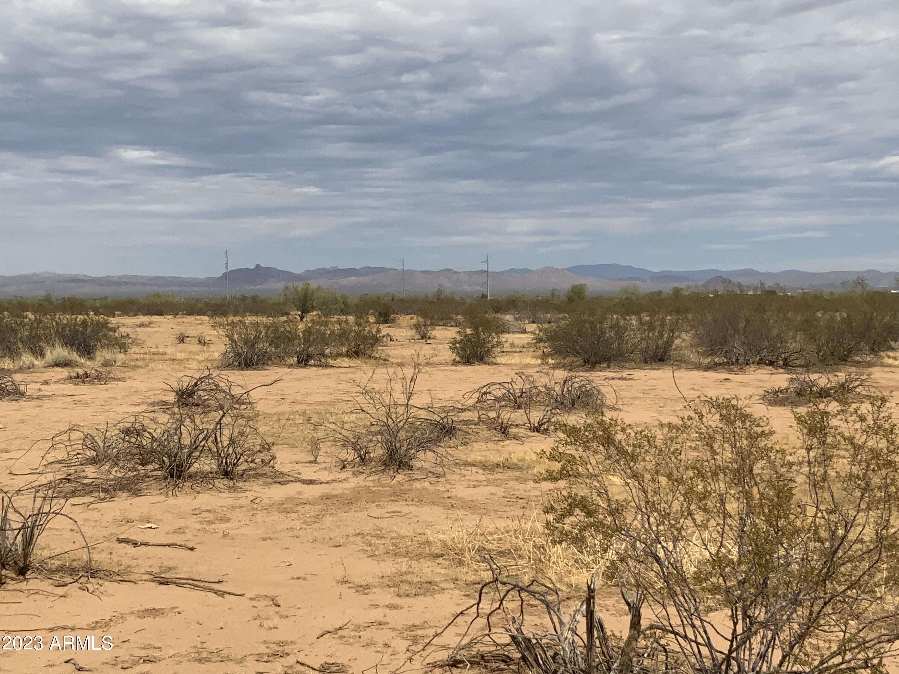 Beautiful 1 Acre Portion of parent Lot. Start your own homestead close to town but quiet with stars.   Escape to the country - but be minutes from the city. This is it!  Fully buildable lot (No APZ, No Noise Contours).  Bring the horses bring your toys.  Site Built or Manufactured Okay! 

Wittmann is located in an area of current rapid growth. Chip plant commuting distance. Located along US60 in the central part of Arizona, it is about 35 miles northwest of Phoenix. The nearby city of Surprise has, in recent years ,annexed much of the land near and around the town, and has included it as part of the city's general plan.