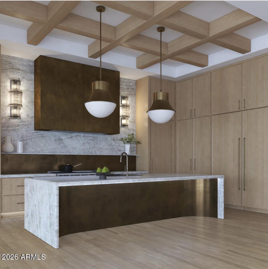 Introducing an extraordinary new construction estate in the heart of Paradise Valley, where timeless transitional design meets modern luxury across approximately 8,600 square feet of thoughtfully curated living space on just over an acre.
Designed for both elevated entertaining and everyday living, the home is anchored by a stunning great room with soaring ceilings, seamless indoor-outdoor flow, and a refined yet warm aesthetic. The chef's kitchen is a true centerpiece, featuring custom cabinetry, statement lighting, premium appliances, and an expansive island ideal for gathering.
A split floor plan offers both privacy and functionality, with five spacious bedrooms, including a secluded primary wing designed as a private retreat. The primary suite is complemented by a dedicated wellness and spa space--creating a serene, resort-like experience within your own home.
The estate also features a fully equipped, approximately 1,000 square foot detached casita complete with its own kitchen and living space--perfect for guests, extended family, or private quarters.
Outdoors, the property transforms into a true desert oasis with a resort-style pool and spa, expansive patio areas, and a private sport court--offering endless opportunities for relaxation and recreation.
Set on a generous lot in one of Paradise Valley's most coveted locations, this home delivers the perfect balance of sophistication, comfort, and Arizona luxury living.