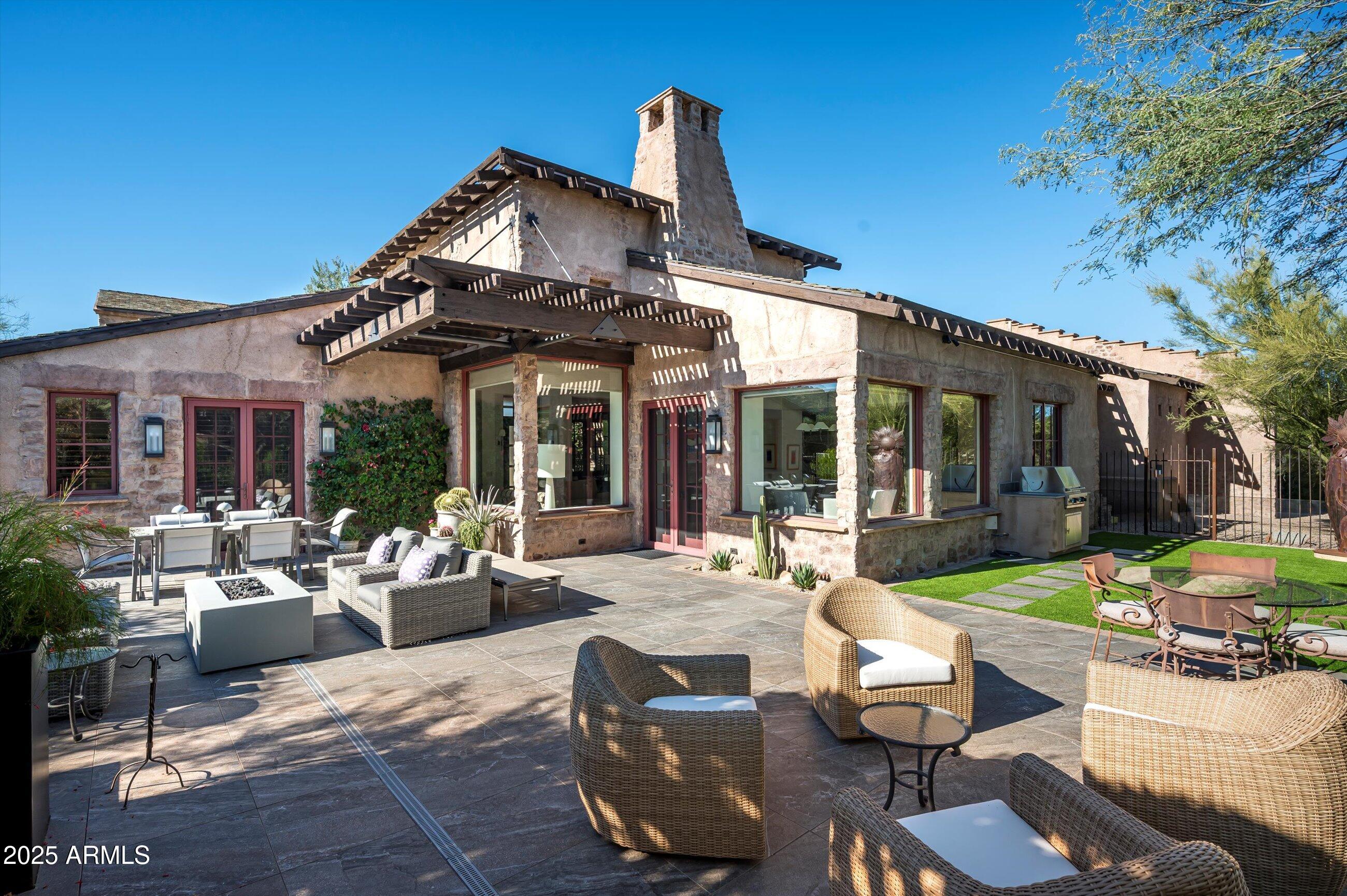 Prime location within the guard-gated community of Estancia's La Scala enclave * Terracina floor plan offers the ideal lock-and-leave lifestyle, while providing privacy and serene indoor/outdoor living * The main home offers a courtyard entrance, open floor plan, primary suite and secondary suite, with adjoining guest casita in the front courtyard * The expanded backyard is south-facing and offers a built-in BBQ, turf area, multiple seating opportunities and a jacuzzi ramada *