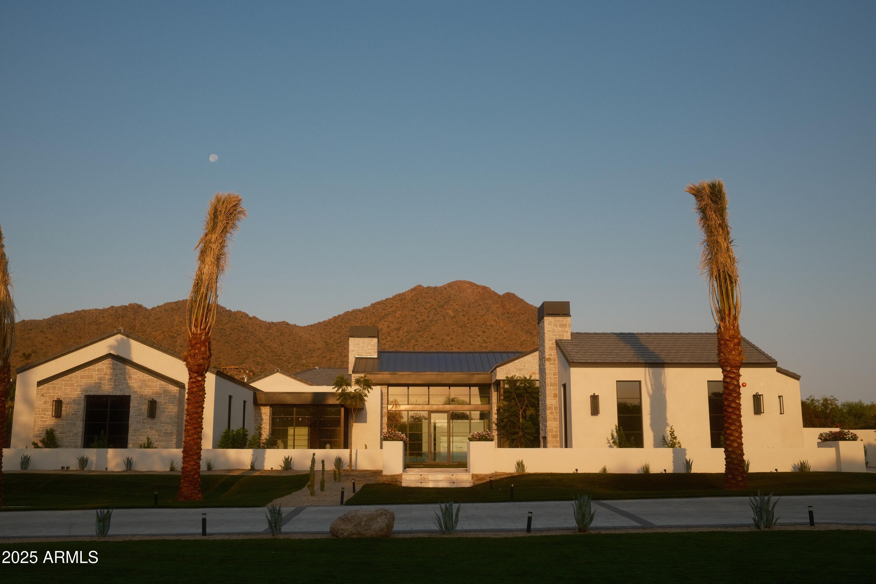 Introducing an extraordinary opportunity from Patterson Homes—one of the last chances to own on one of Paradise Valley's most prestigious streets. This 11,000-square-foot residence has been thoughtfully designed to maximize breathtaking, unobstructed views of Camelback Mountain and The Monk. The home offers a seamless blend of indoor and outdoor living, perfectly framing Arizona's stunning natural beauty.

Don't miss this rare opportunity to claim a piece of Paradise Valley's finest real estate.