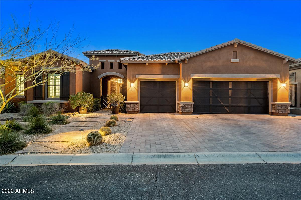 The Marchetti model is available in Windgate Ranch! This 5 bedroom/5 bathroom home is on a premium, desert wash lot with city views. Walk through the gated courtyard to find an office/casita with custom built-ins and a full bath. The main house features a two-story floorplan. On the first level is a gourmet kitchen with Wolf appliances and dual-islands. The kitchen opens to a breakfast area and great room. A formal dining room is off the great room. The spacious master suite features multiple walk-in closets, split vanities and marble finishes. An additional 2 bedrooms, 2 baths and den are on the main level. Upstairs, is an additional bedroom, full bath, large game room and patio. The resort-style backyard features a covered patio, heated pool and spa, fire pit, built-in BBQ and turf lawn.