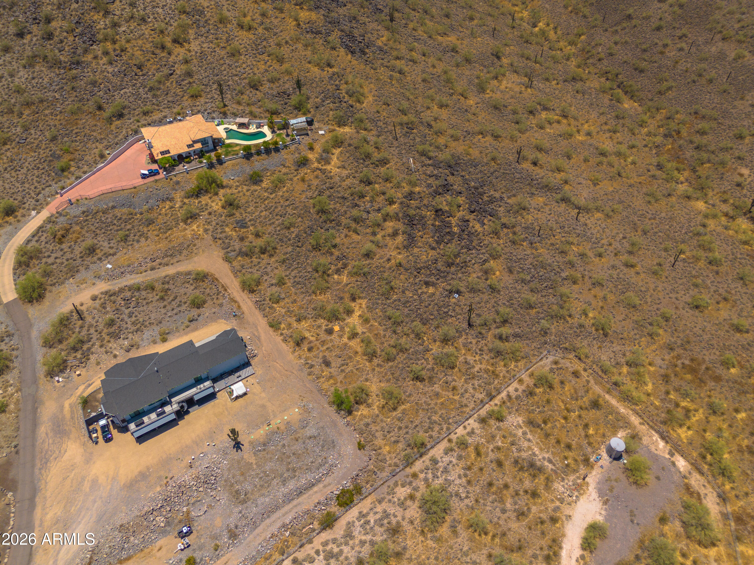 YOUR DREAM HOME AWAITS! Stunning mountainside lot with breathtaking, panoramic views!  Bordering State Land, this exceptional property offers privacy, open space and endless opportunities to create your custom home or retreat.  The property includes access to a shared well, with electricity available nearby.  A private road serves the adjacent parcel, and the buyer will have an easement to install a road to the property. Conveniently located with easy access to the rapidly growing North Phoenix Corridor, the property is just a short drive from TSMC.  Enjoy the perfect balance of peaceful desert living while remaining close to major employment centers, shopping, dining, and amenities.  Don't miss this chance to own a unique piece of Arizona paradise!