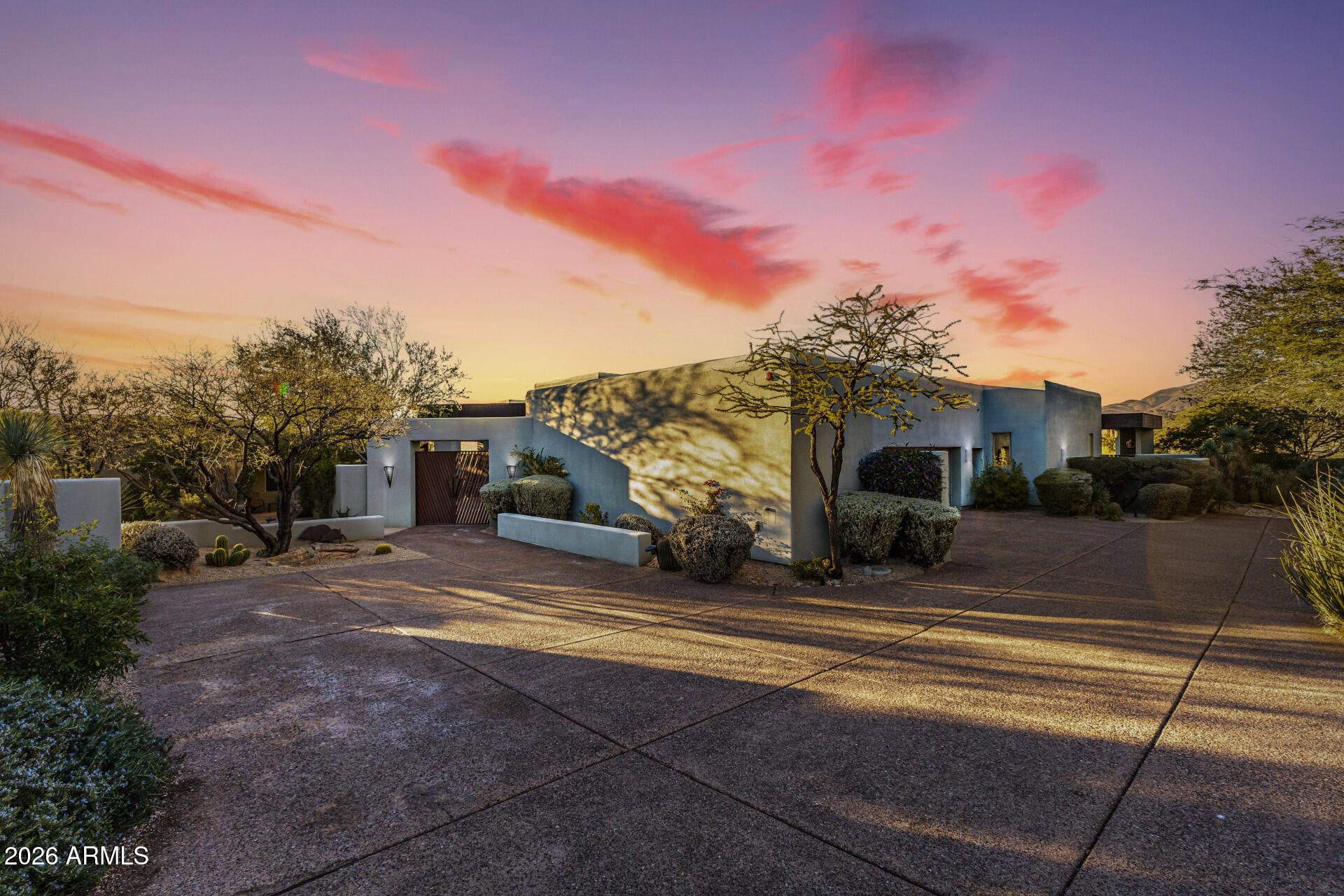 ****FULL GOLF MEMBERSHIP AVAIL**** 
A RARE masterpiece of luxury and distinction, this extraordinary estate delivers RESORT-STYLE living at its absolute finest! Ideally positioned on an over one-acre golf course lot within the prestigious guard-gated Community of Desert Mountain. Surrounded by breathtaking mountain & desert panoramas, this is an offering so exclusive that opportunities of this caliber are seldom available. Its charm starts with mature desert landscape, great curb appeal, gated courtyard, and an oversized 3-car garage w/cabinetry. The elegant interior unfolds with soaring ceilings, a neutral palette, recessed lighting, and soft carpet & tile flooring, enhanced by large picture windows for abundant natural light and stunning scenic views. The seamlessly flowing living & dining room is paired with a fireplace and floor to ceiling windows. The gourmet kitchen stands as a showpiece, featuring its own fireplace, high-end appliances, granite counters & backsplash, a plethora of cabinetry, a sizable center island, a cozy nook w/wet bar, and a butler's pantry w/built-in appliances. The entire upper level is reserved as an owner's sanctuary, offering unmatched privacy and scale! This expansive retreat includes a fireplace and an office or sitting room with sliding doors opening to a private balcony, making sweeping mountain and desert vistas part of daily life. The lavish ensuite has two vanities, a jetted tub, a separate shower, and a large walk-in closet. The walk-out basement extends the home's livability and functionality, providing direct access to the backyard! Featuring a spacious game room w/wet bar, two secondary bedrooms w/their own bathrooms, and a versatile den ideal for a fitness space or creative retreat. Laundry room with a sink & ample cabinetry for added convenience. PLUS! Enhancing the estate's versatility is a spacious detached casita, offering its own living area, separate entrance, kitchenette, and two private bedrooms w/their own bathroom, perfect for hosting guests, multigenerational living, or extended stays with absolute privacy. The backyard oasis is the crown jewel of this remarkable property! Beautifully finished with elegantly laid flagstone, a built-in BBQ, and a sparkling pool & spa for year-round enjoyment. This outdoor space is framed by uninterrupted mountain, desert, and golf course views, a setting that is both serene & awe-inspiring. Words can hardly capture the essence of this estate! Take advantage of the world-class amenities, including championship golf courses, a private country club, fitness & spa facilities, tennis & pickleball courts, scenic hiking trails, and refined dining experiences. What's not to like? See it! Love it! Live it!
