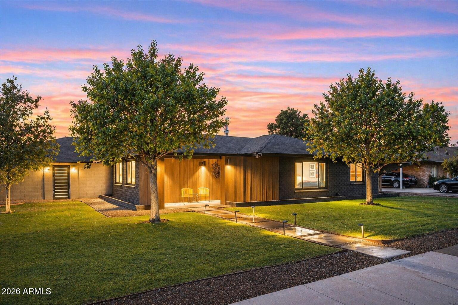 Are you looking at that price and thinking - is this too good to be true? It may be, and this is your chance to own a mid-century modern done right--this single-level stunner is pure Arcadia Lite. Sitting on an oversized corner lot with an electric RV gate, resort-style pool, and 2-car garage with EV charger. The curb appeal hits instantly, tucked into a quiet pocket that feels like a hidden find. Inside, it's bright, open, and designed to impress--the kitchen anchors the space with a bold designer island and sleek dry bar (and walls that deserve real art). Split floorplan perfection: primary suite on one side, three bedrooms on the other, with seamless living in between. Outside, a sparkling pool, putting green, and lounge space deliver the kind of backyard that actually gets used.