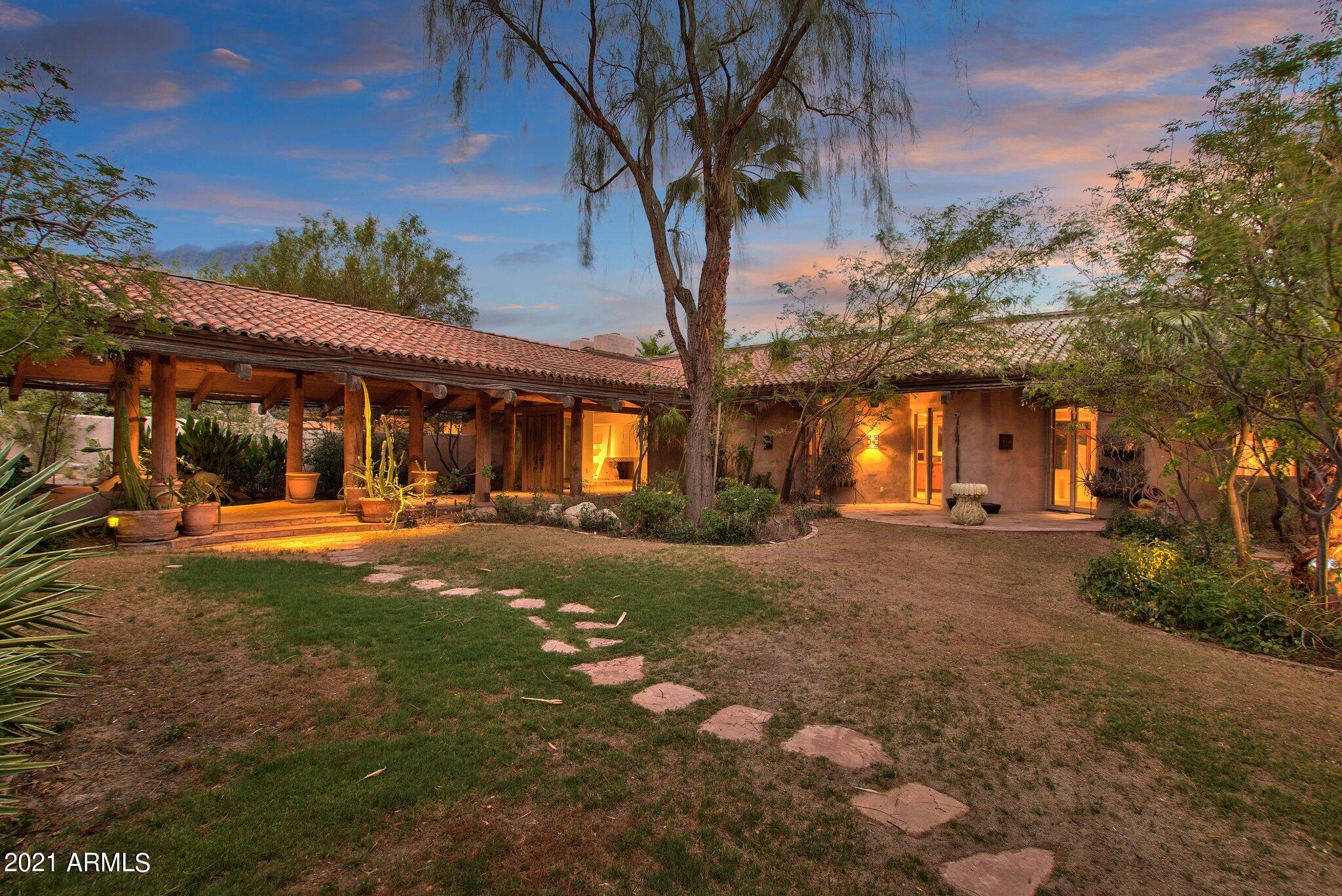 SEE ADDITIONAL REMARKS, VIRTUAL TOURS & DOCUMENTS for complete description of 3702 & 3730 E El Camino Sin Nombre Estate

The Main Home was designed by world-famous AIA architect, Gordon Rogers, constructed in 1993.  It sits on one of the two parcels of land on this estate, just over 1.7 acres behind a gated entryway.  The second home sits on just over 1.2 acres and was built in the 1950's, also behind the same gate.  Together they sit on just under 3 acres of land that has been left largely natural desert landscaping with at least 8 parking spaces inside the various garages.  The seller's favorite thing about the property is that you can get lost in the trees of the property and not see any other buildings around making it feel much more ''in the desert'' versus a stone's skip away from. 3702 & 3730 E El Camino Sin Nombre Estate 

The Main Home was designed by world-famous AIA architect, Gordon Rogers and constructed in 1993.  It sits on one of the two parcels of land on this estate, just over 1.7 acres behind a gated entryway.  The second home sits on just over 1.2 acres and was built in the 1950's, also behind the same gate to the estate.  Together they sit on just under 3 acres of land that has been left largely natural desert landscaping with at least 8 parking spaces inside the various garages.  One of the seller's favorite things about the property is that you can get lost in the trees of the property and not see any other buildings around making it feel much more "in the desert" versus a stone's skip away from the Biltmore area.  Yet with the rooftop patio above the main home garage, you can see your 360 degree view of the city and surrounding mountains.

With a spanish tile roof exterior feel and a warm sante fe styling interior design, you enter the main home through the front courtyard covered in luscious grass with a step stone pathway up to the connecting walkway and entrances to the 5638 sqft main home and 1012 sqft two story casita.  This grand walkway has a beautifully placed Koi pond and garden area beneath the large covered patio area between these two buildings. Both buildings have fantastic solid wood antique entryway doors.  If the roof structure outside did not wow you, the main roof structure, running the length of the home, that is supported with huge natural wood poles and beams with natural skylight ridge, will have you in awe.  Ocotillo pole inlays are in the ceiling through much of the main home and some of the accompanying rooms.  The main entry is aligned with the formal dining room when you enter with views through the house and out to the pool and patio areas.  The house has a split floor plan with the Main suite and library to the left.  

On your way to the main suite you will pass the library with a secret loft reading room and you may begin to notice the windows lining nearly the entire South Easterly facing side of the home looking out over the pool toward Camelback Mountain.  The NE end of the home is the entire Main Bedroom suite including patio access and windows along the NE side of the house with an in ground hot tub nearby.  His and her closets, sinks, restrooms and showers in addition to a large soaking tub with a view.  There is a workout room with a second shower just off of the Main Suite on the gentlemens side.

As you make your way back through the house past the formal dining room, you make your way to a huge dine in kitchen and great room concept living space with stunning vaulted ceilings.  This spacious kitchen includes indoor bbq with commercial grade venting, dual ovens, large electric cooktop with gas stub if preferred, built-in refrigerator and stunning view of the pool and Camelback Mountain.  The kitchen is separated well from the rest of the great room yet the space still feels wide open, warm, and inviting.  Throughout the home you will also find little nooks and alcoves with bookshelves and seating areas to lose yourself in a book on a fine afternoon. 

The enormous great room opens to the back patio that runs the length of the NE side of the home and has its own outdoor kitchen with an antique Ice Box.  Tucked away in the natural desert landscape your backyard pool oasis is a quiet escape from the busy pace of life.  There is also a small pool house with shower, bathroom, storage, fireplace and charcoal stove cooking area.  Just beyond the pool house there is a full sized sports court currently set up for tennis.  As we make our way back into the house, there is an office or study area separating two of the other bedroom suites located on the South side of the house.

On the North side of the great room is the hallway to one more additional small bedroom, a large laundry and utility room, another bathroom that can be accessed through the bedroom or by the hallway, and the 3 car garage attached to the main home.   There is an air conditioned and heated dog kennel along with outdoor dog run spaces.  There is even an outdoor cat housing area, both perfect for those who love pampering their animals and even fostering other animals.  The house has natural gas, HVAC and evaporative cooling.  It has been designed and landscaped in such a manner that it gets very little direct sunlight in the summer to help keep the home and surrounding area cooler.

The smaller and original home on the estate was built in 1956 with MidCentury design and feel.  The exterior was updated in the 80's sometime and the brick used came from Queen Creek.  Coming in at 2182 sqft with 3 full bedrooms and 2 full bathrooms, it is the perfect Guest House for visiting family and friends.  The kitchen and bathrooms are still original, so this one could easily be remodeled with a Mid Century Modern design.  A spectacular glass lined room looks out over the backyard with a pool and unobstructed views of Piestewa Peak.  There is an attached 2 car garage and a detached oversized 2 door garage that can fit 3 to 6 vehicles, depending on if you use lifts or how big the vehicles are, that we believe was built in the 80's as well.

The sellers built the main home and have lived in it since.  Due to the changing seasons of life, they have decided it is time to downsize and sell the property.  They prefer that the main home remain, and understand the smaller home may be replaced.  They prefer that the two parcels are sold together.  Should they be separated, an easement agreement would need to be put in place for driveway and access to both homes.  For pre-qualified buyers or with proof of funds, we can arrange for private showings.  The home is currently in the late stages of the family moving out and being prepared for market.